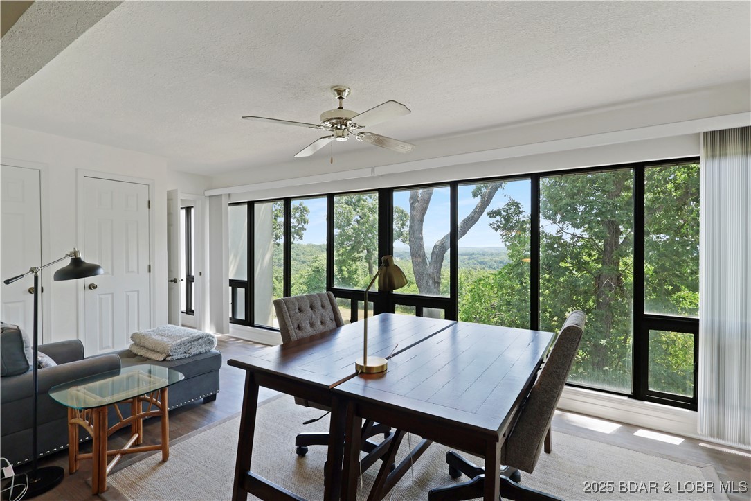24 East Casa Del Rio, Unit 693 Lake Ozark, MO 65049 - Photo 25 of 30 Sunroom with nice view.