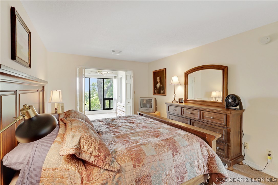 24 East Casa Del Rio, Unit 693 Lake Ozark, MO 65049 - Photo 28 of 30 Guest bedroom.