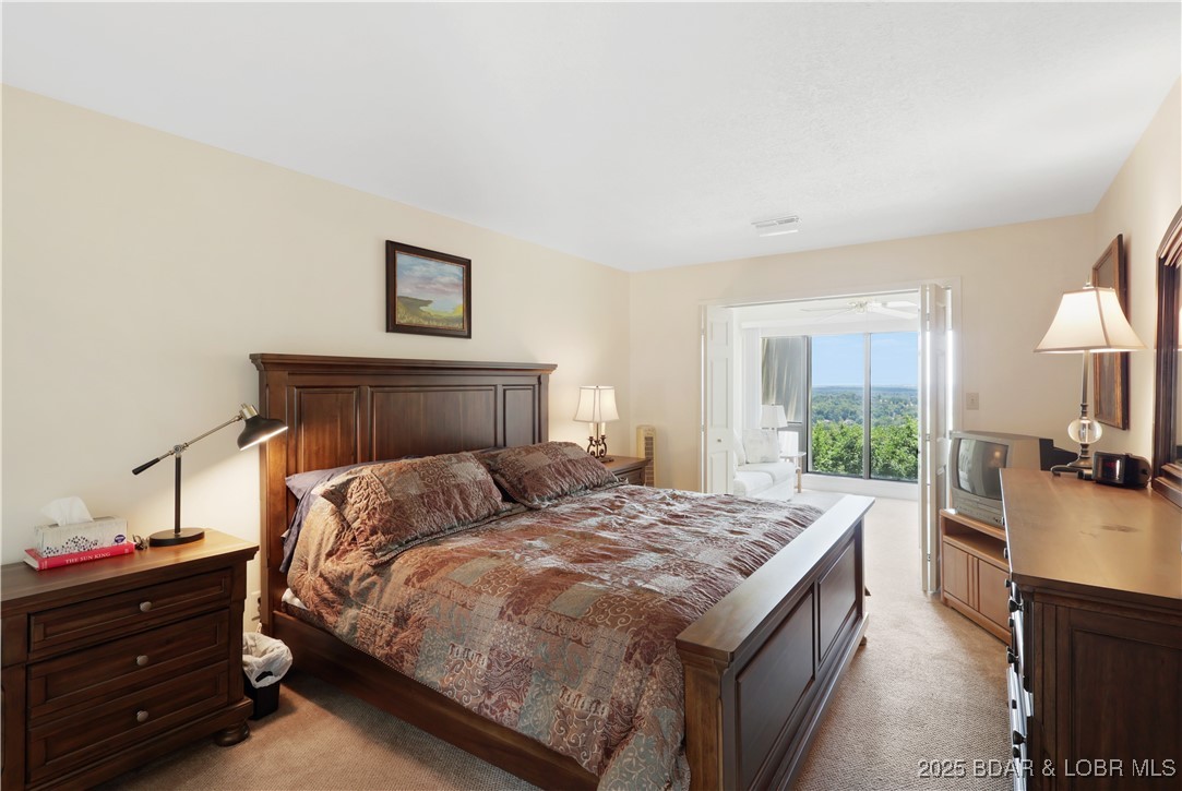 24 East Casa Del Rio, Unit 693 Lake Ozark, MO 65049 - Photo 29 of 30 Guest bedroom.