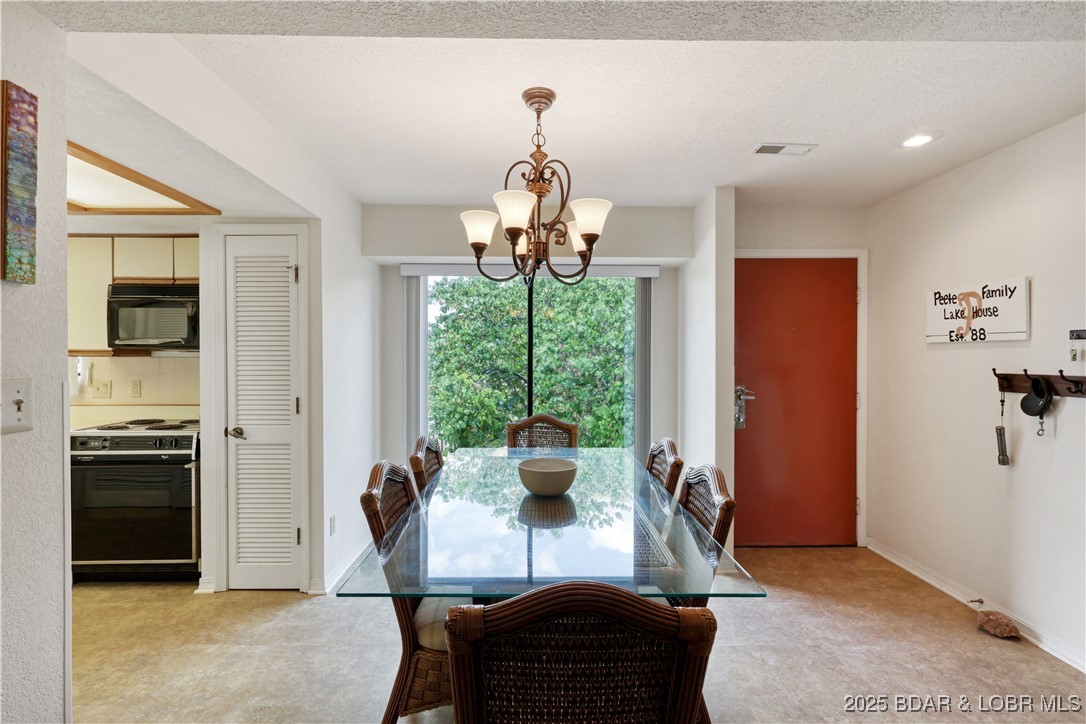 24 East Casa Del Rio, Unit 693 Lake Ozark, MO 65049 - Photo 8 of 30 Dining area off of front entrance.