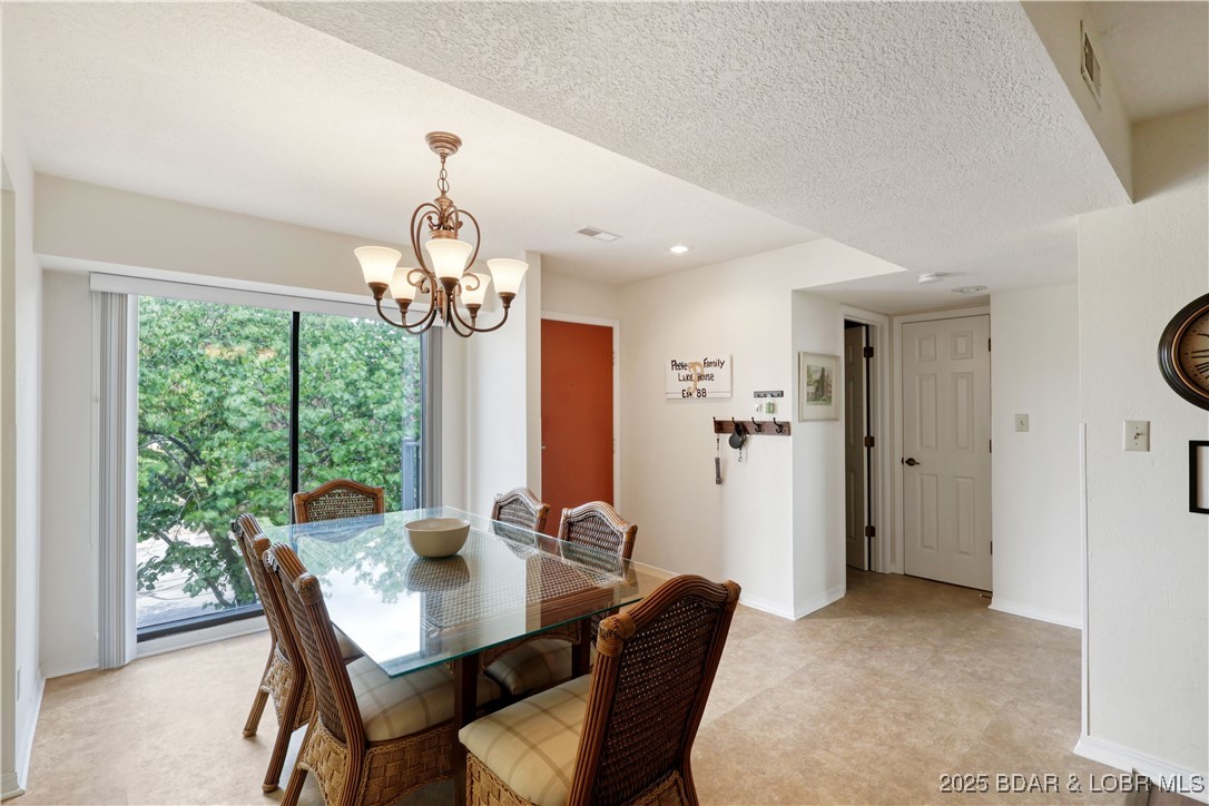 24 East Casa Del Rio, Unit 693 Lake Ozark, MO 65049 - Photo 9 of 30 Roadside dining area.