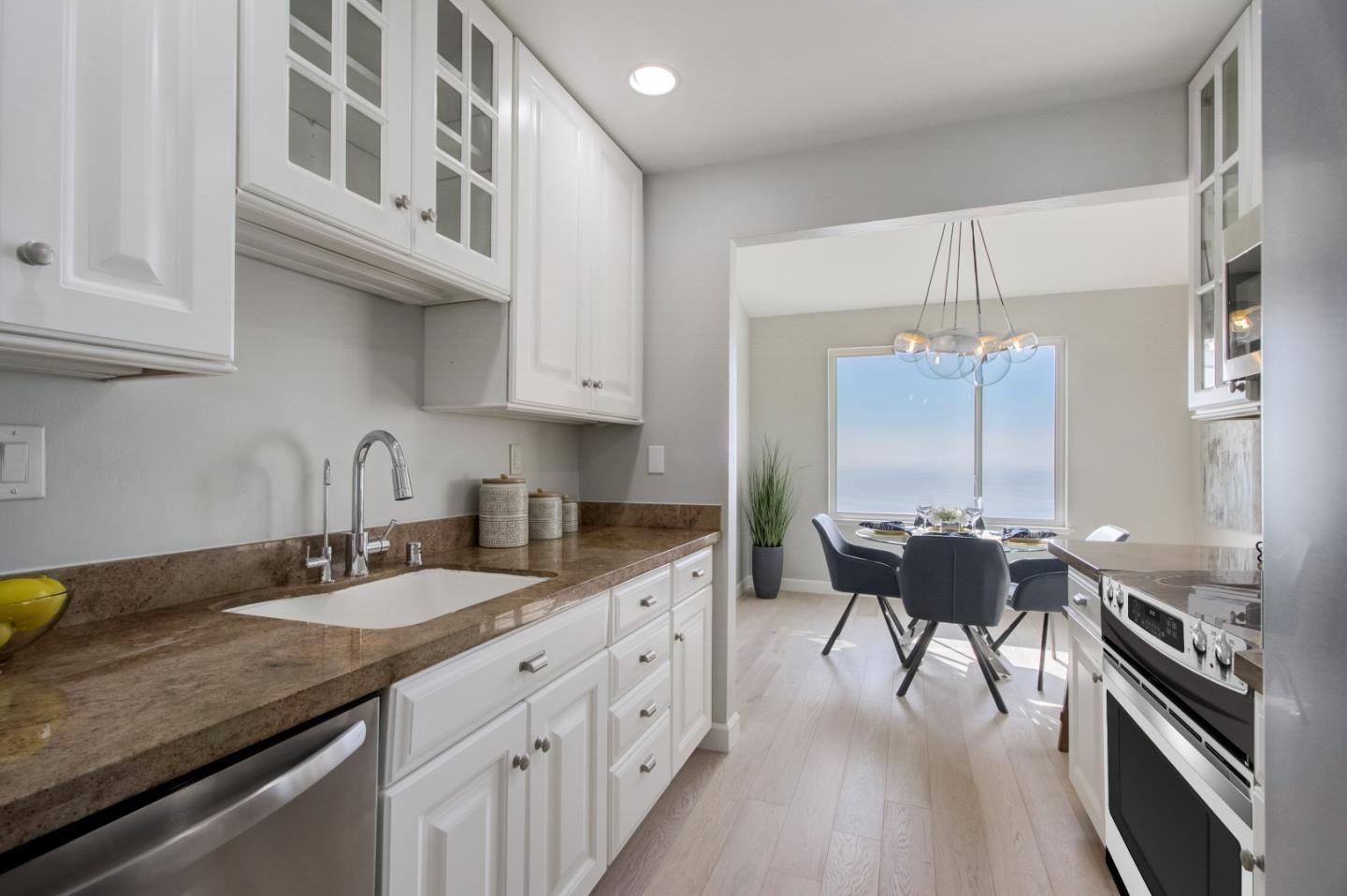 5007 Palmetto Avenue, Unit 42 Pacifica, CA 94044 - Photo 18 of 53 a kitchen with granite countertop lots of counter top space and stainless steel appliances