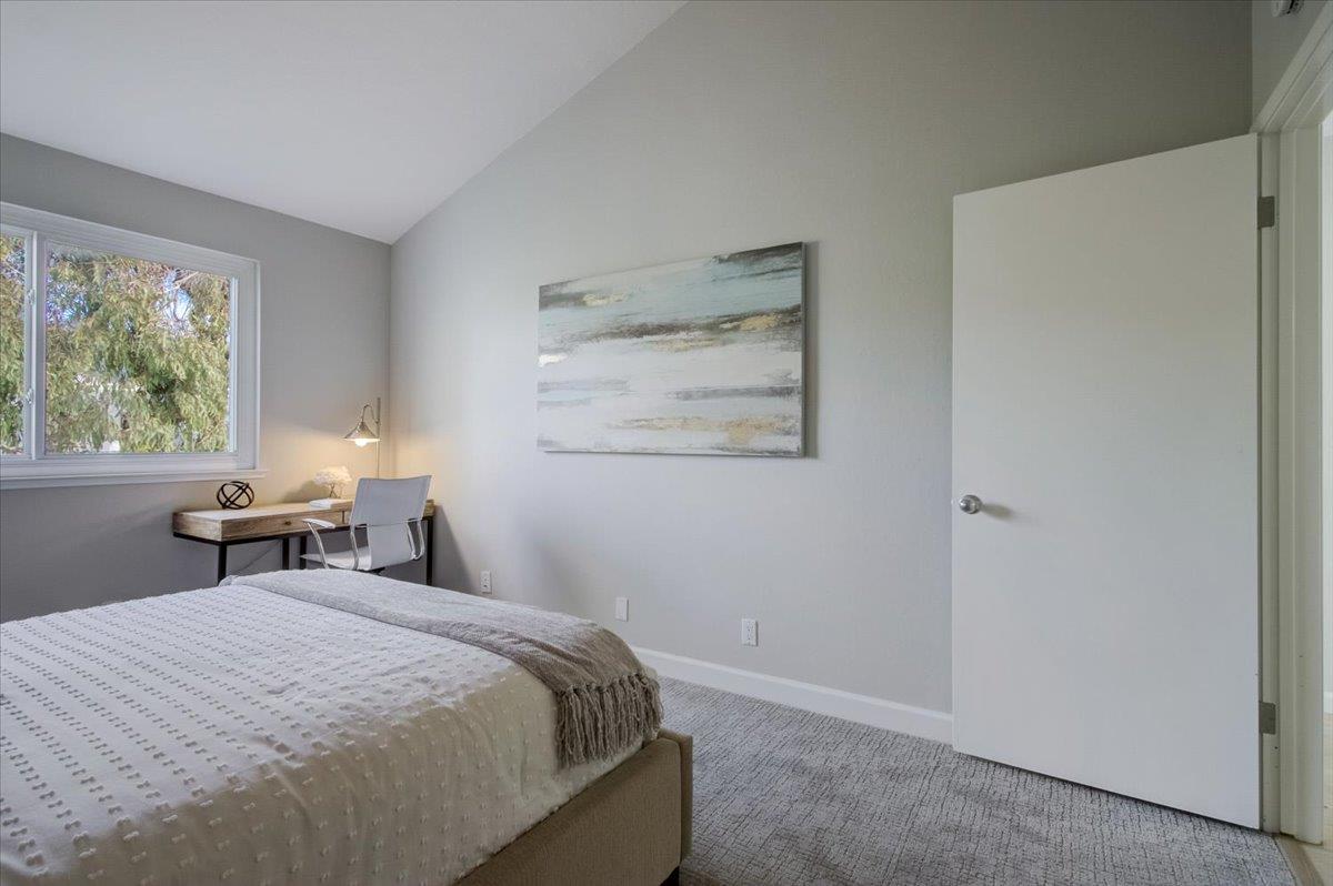 5007 Palmetto Avenue, Unit 42 Pacifica, CA 94044 - Photo 26 of 53 a bedroom with a bed and a window