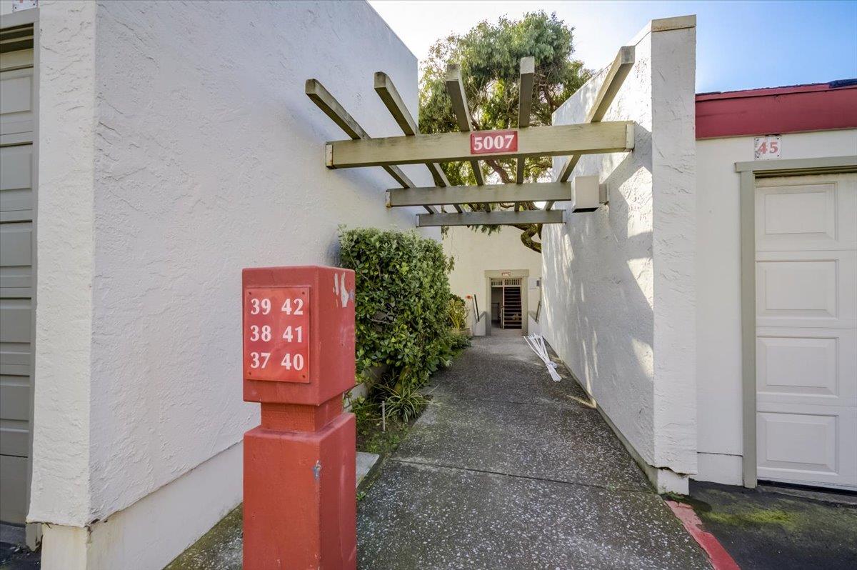 5007 Palmetto Avenue, Unit 42 Pacifica, CA 94044 - Photo 32 of 53 a front view of a house with plants