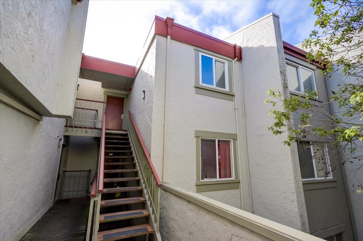 5007 Palmetto Avenue, Unit 42 Pacifica, CA 94044 - Photo 33 of 53 a view of a house with entryway and wooden stairs