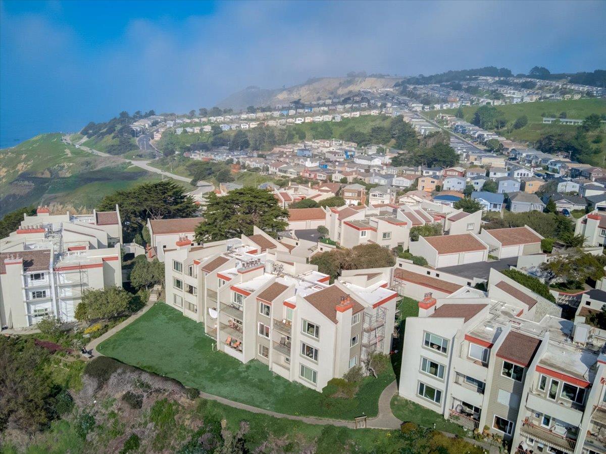 5007 Palmetto Avenue, Unit 42 Pacifica, CA 94044 - Photo 38 of 53 a view of building with yard