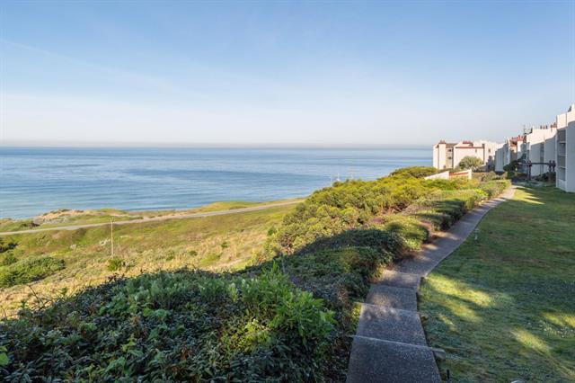 5007 Palmetto Avenue, Unit 42 Pacifica, CA 94044 - Photo 45 of 53 a view of an ocean and a mountain