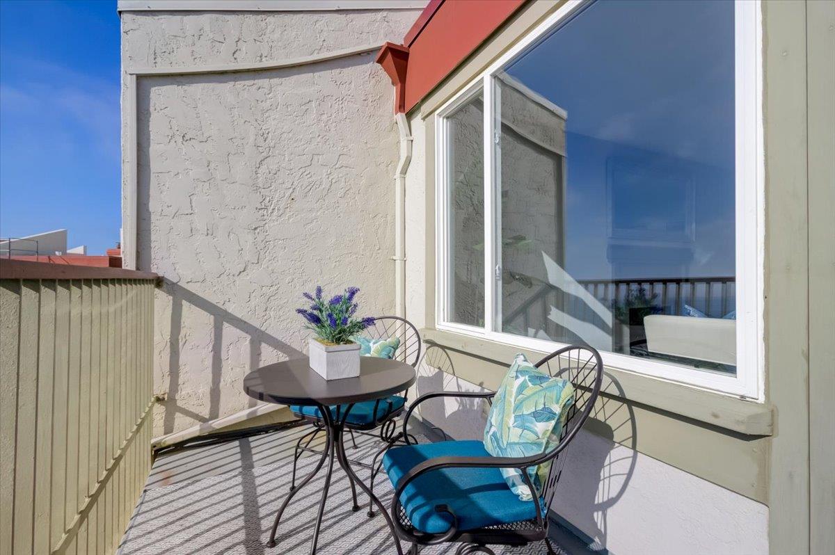 5007 Palmetto Avenue, Unit 42 Pacifica, CA 94044 - Photo 6 of 53 a view of a chair and table in the balcony