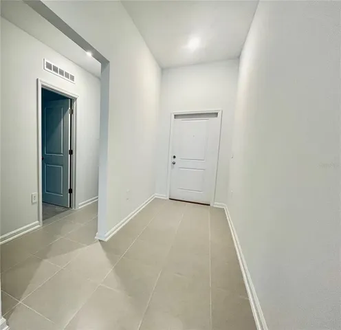 an empty room with closet area