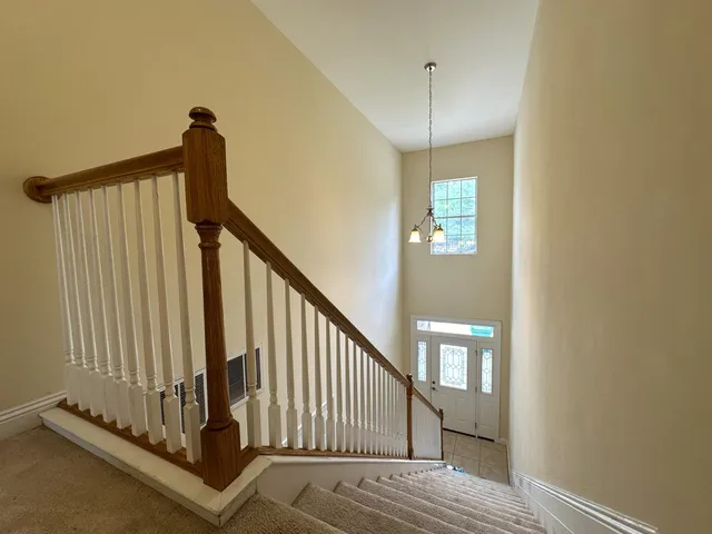 a view of a hallway with staircase