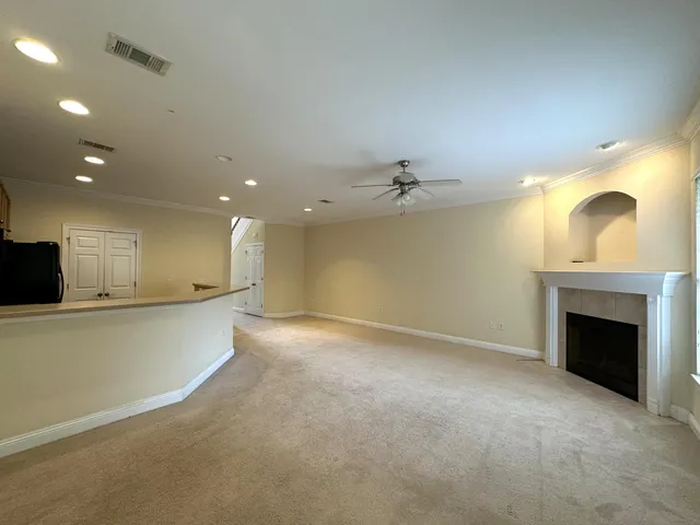 a view of an empty room with a fireplace