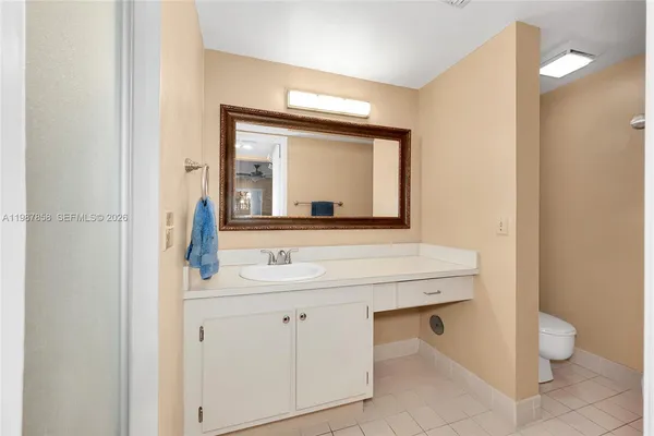 a living room with furniture and a ceiling fan