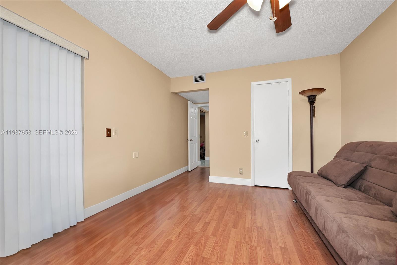 10441 Mahogany Key Circle, Unit 101 Miami, FL 33196 - Photo 18 of 26 a view of room with furniture and wooden floor
