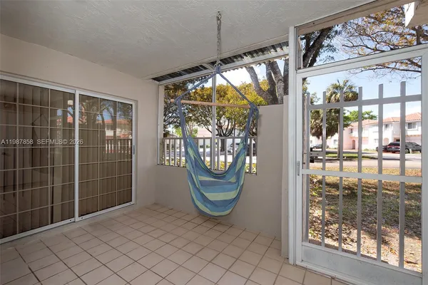 a view of a swimming pool with outdoor seating