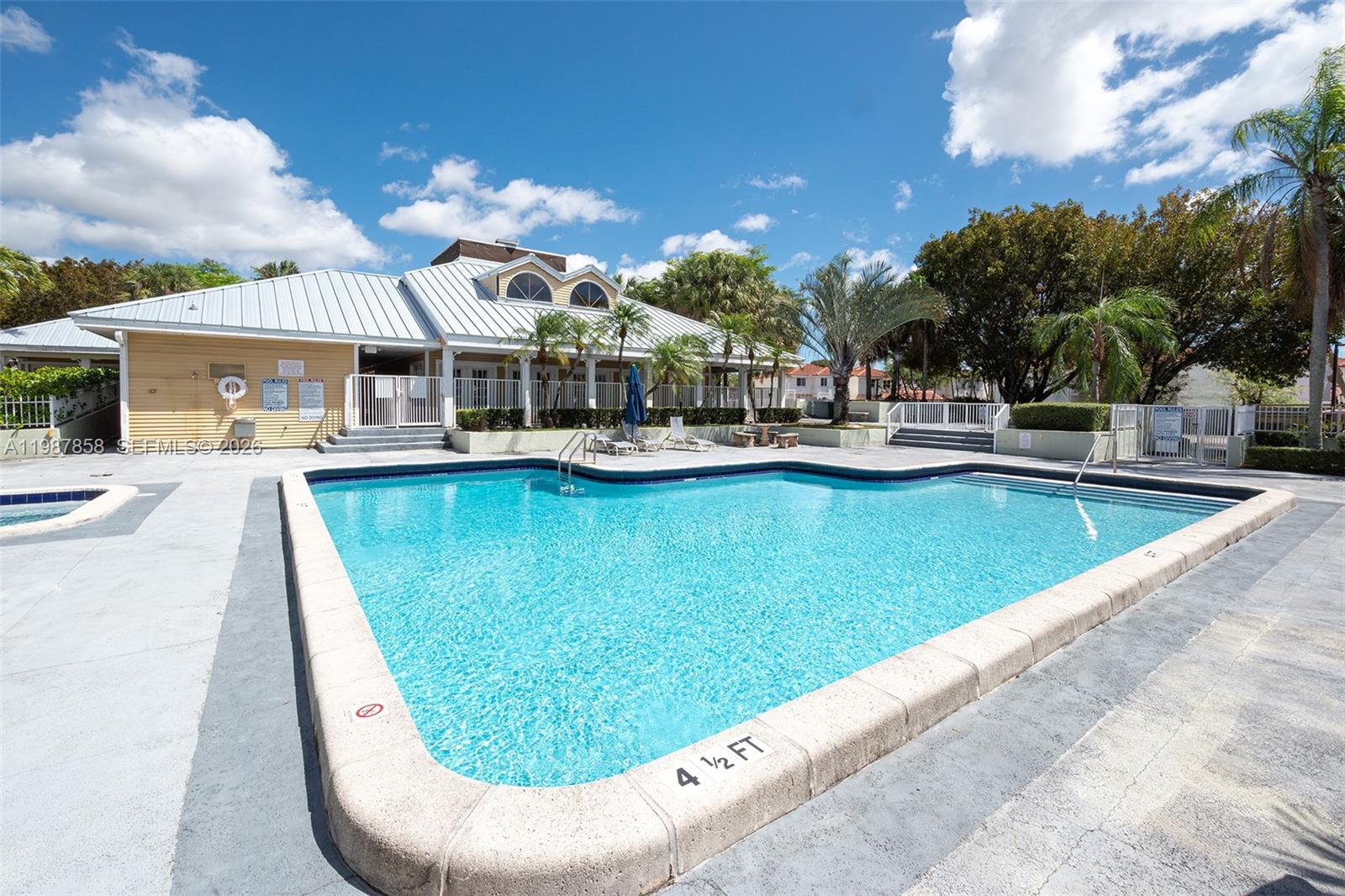 10441 Mahogany Key Circle, Unit 101 Miami, FL 33196 - Photo 23 of 26 a view of a swimming pool with lounge chair
