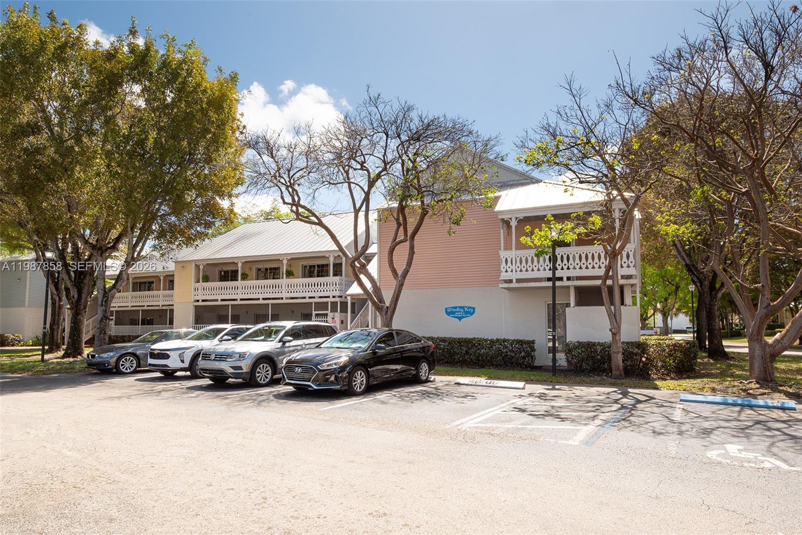 10441 Mahogany Key Circle, Unit 101 Miami, FL 33196 - Photo 3 of 26 a front view of a house with a yard covered with snow