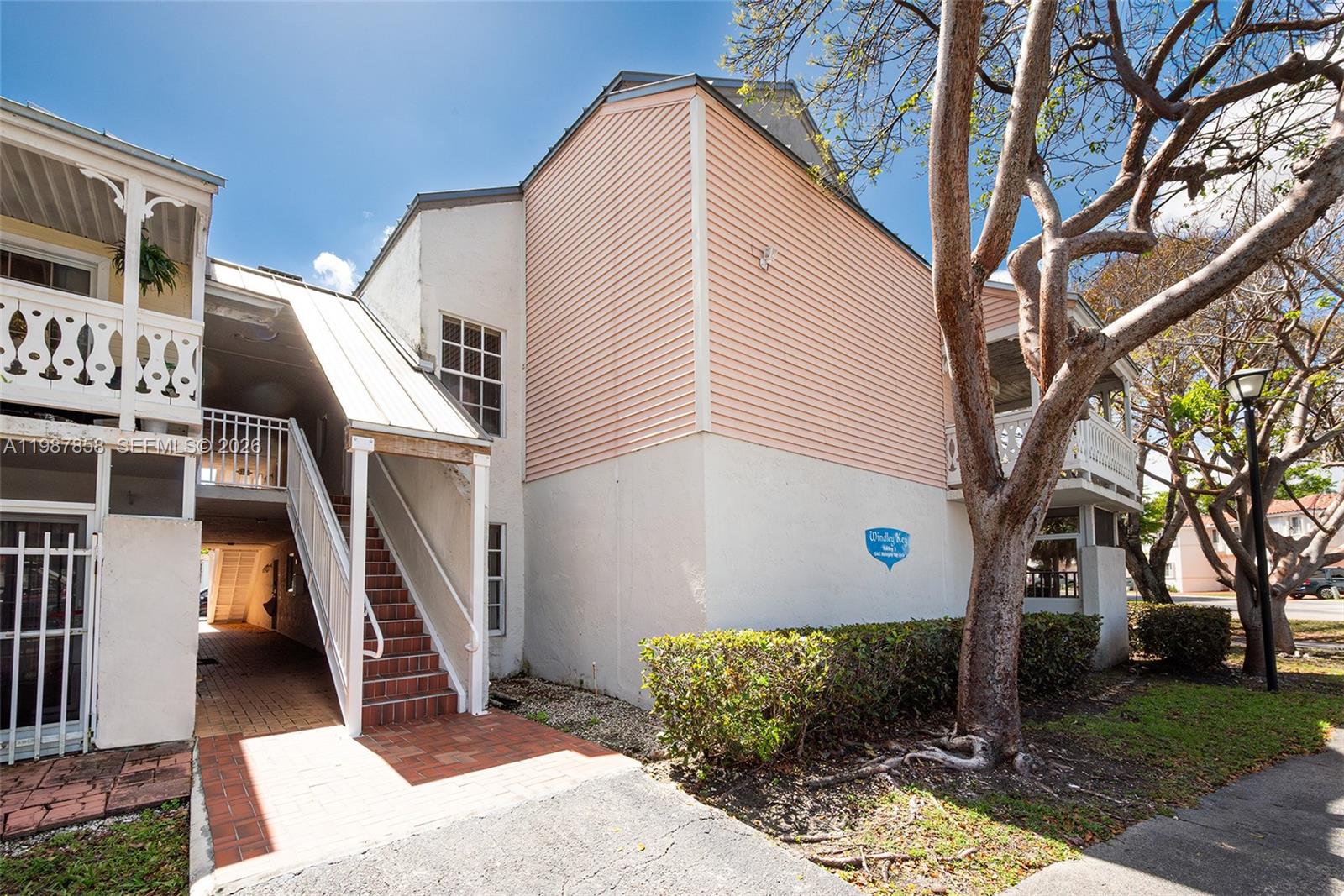10441 Mahogany Key Circle, Unit 101 Miami, FL 33196 - Photo 4 of 26 a front view of a house with a yard