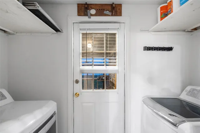 a view of utility room and bedroom