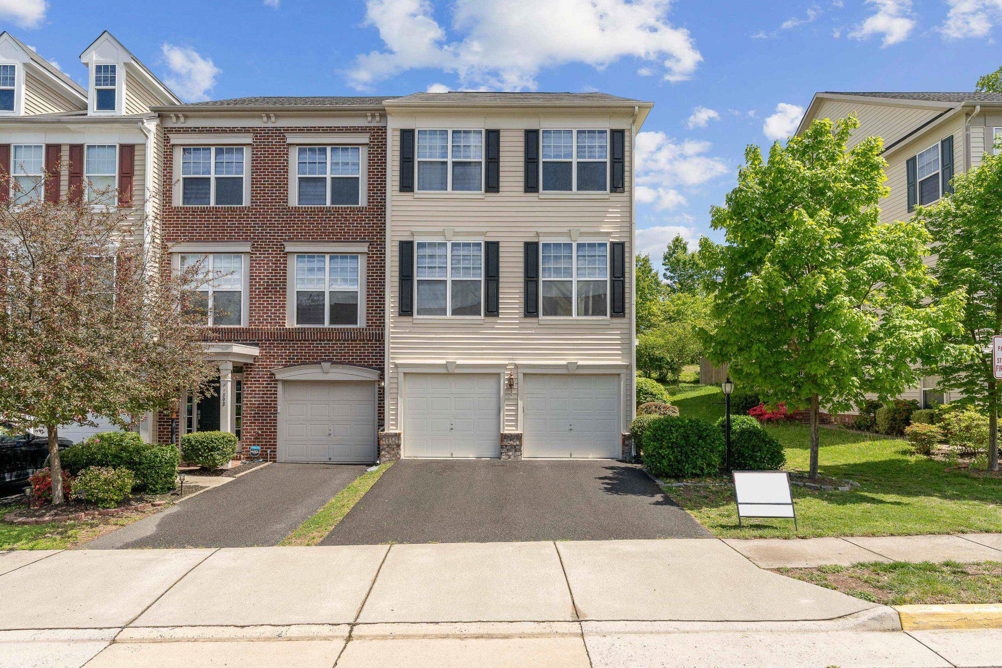 two-car garage townhouse with large driveway