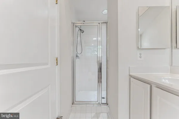 a white bath tub sitting next to a white toilet