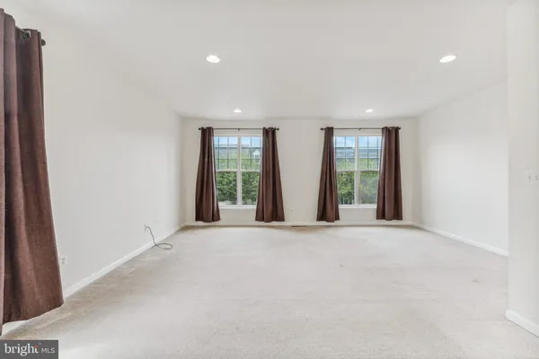 an empty room with windows and view