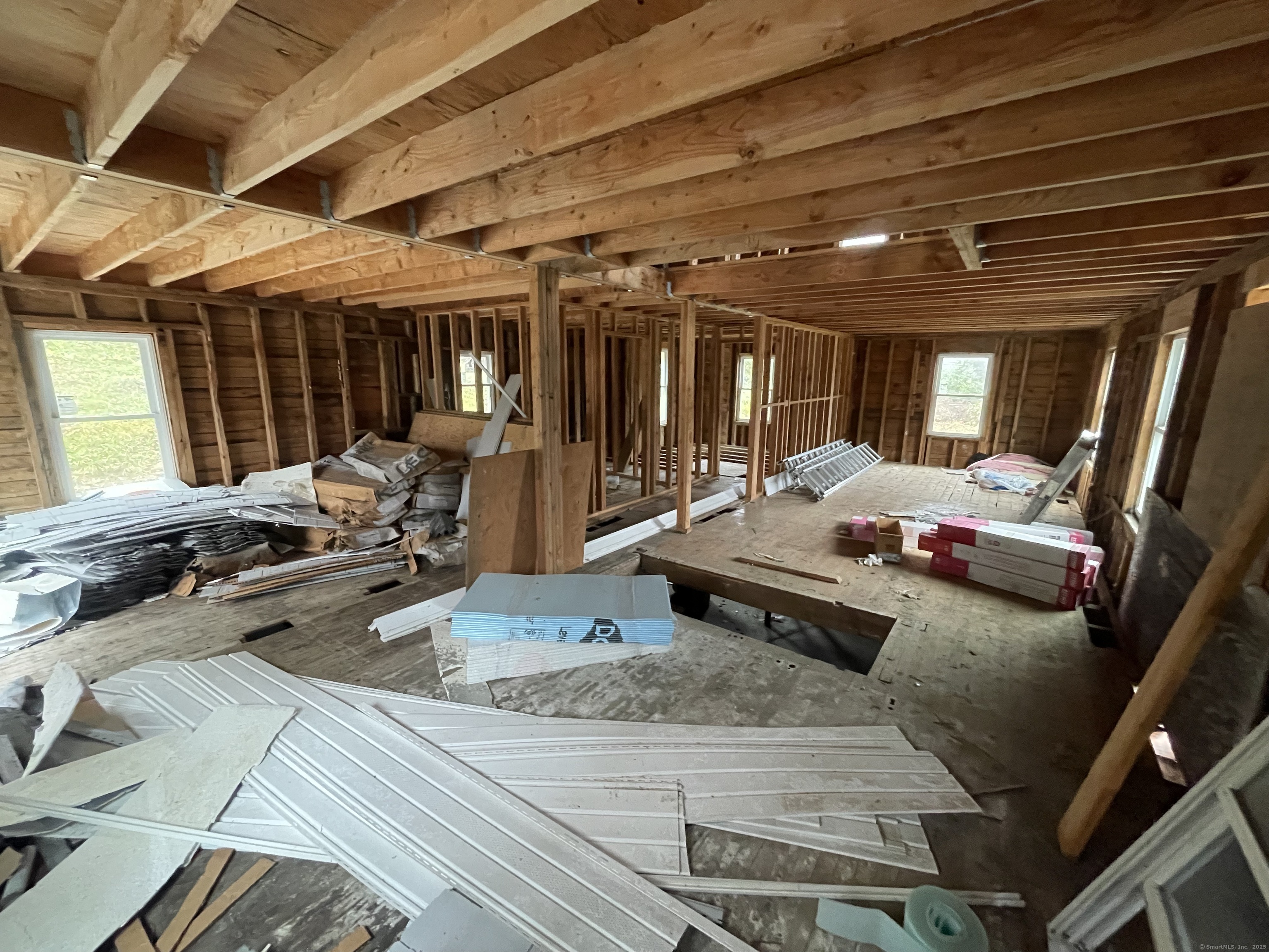 3748 Hall Meadow Road Goshen, CT 06058 - Photo 5 of 10 a view of a patio with table and chairs with wooden floor and fence