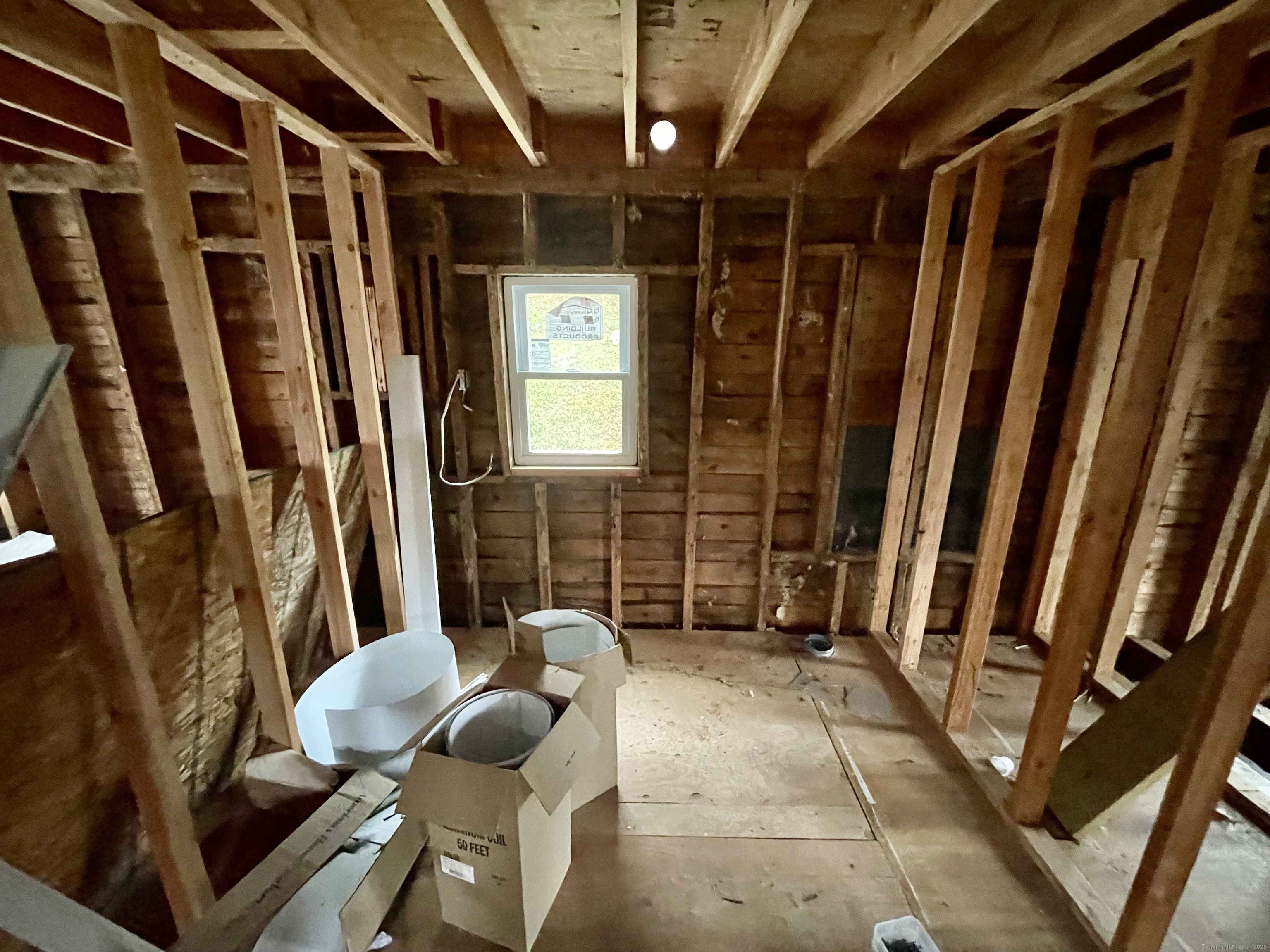 3748 Hall Meadow Road Goshen, CT 06058 - Photo 9 of 10 a view of an empty room with wooden floor and furniture