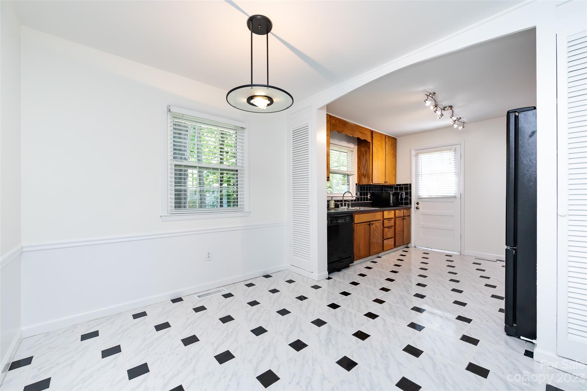 1506 Rama Road Charlotte, NC 28211 - Photo 11 of 48 a kitchen with granite countertop a sink a stove and refrigerator