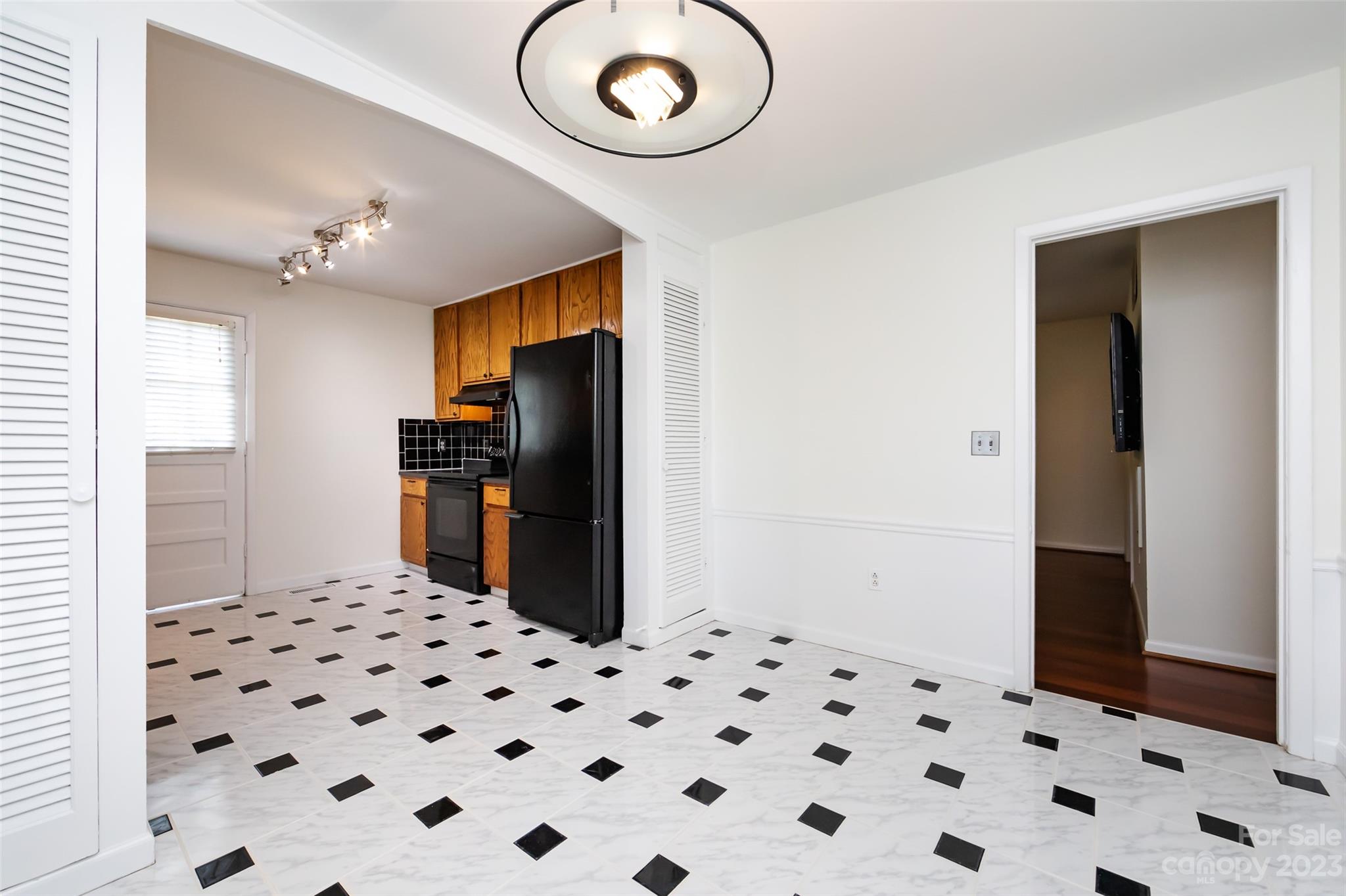 1506 Rama Road Charlotte, NC 28211 - Photo 12 of 48 a room with a black white checkered floor