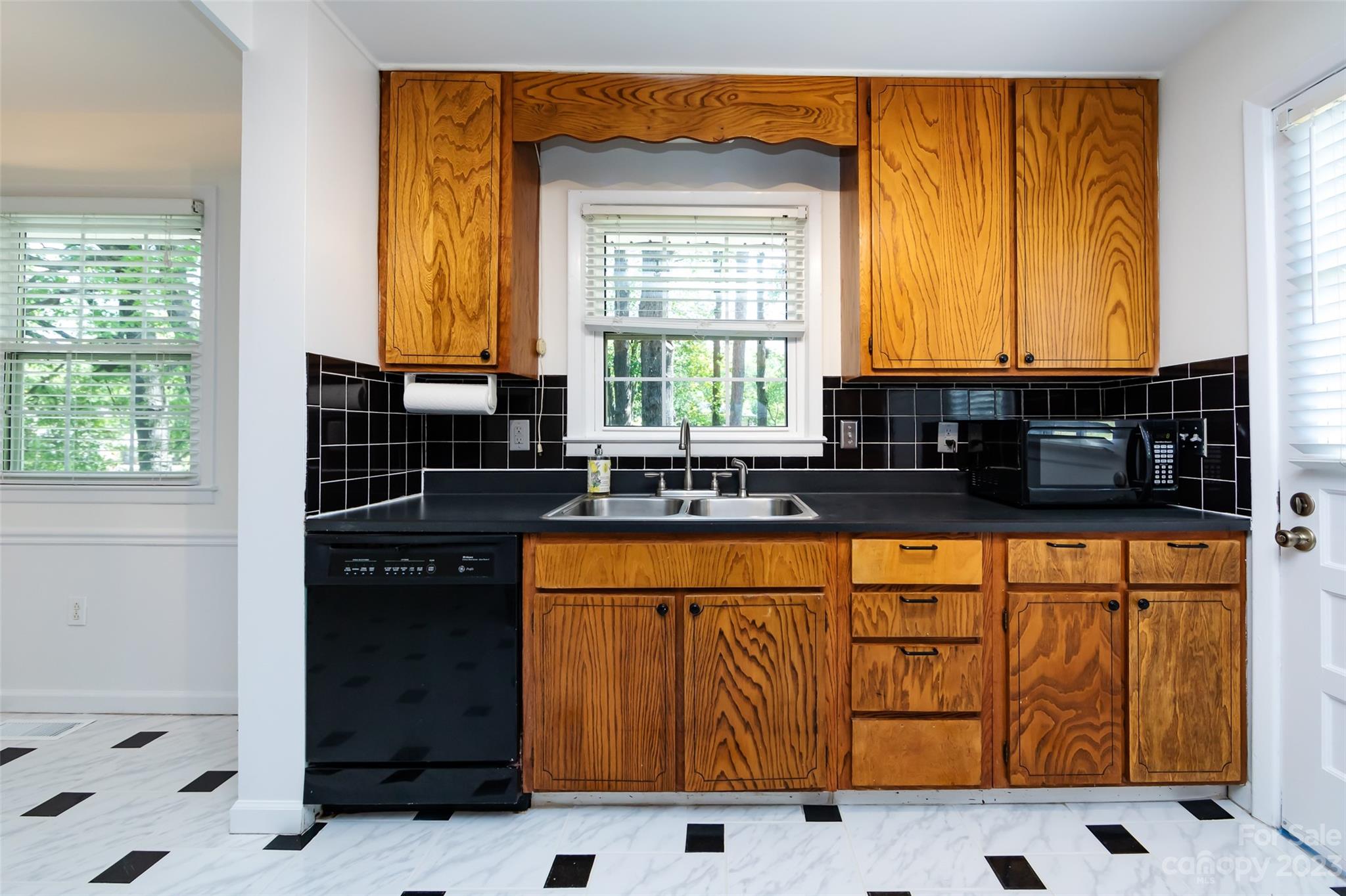 1506 Rama Road Charlotte, NC 28211 - Photo 14 of 48 a kitchen with stainless steel appliances a sink a stove and a refrigerator