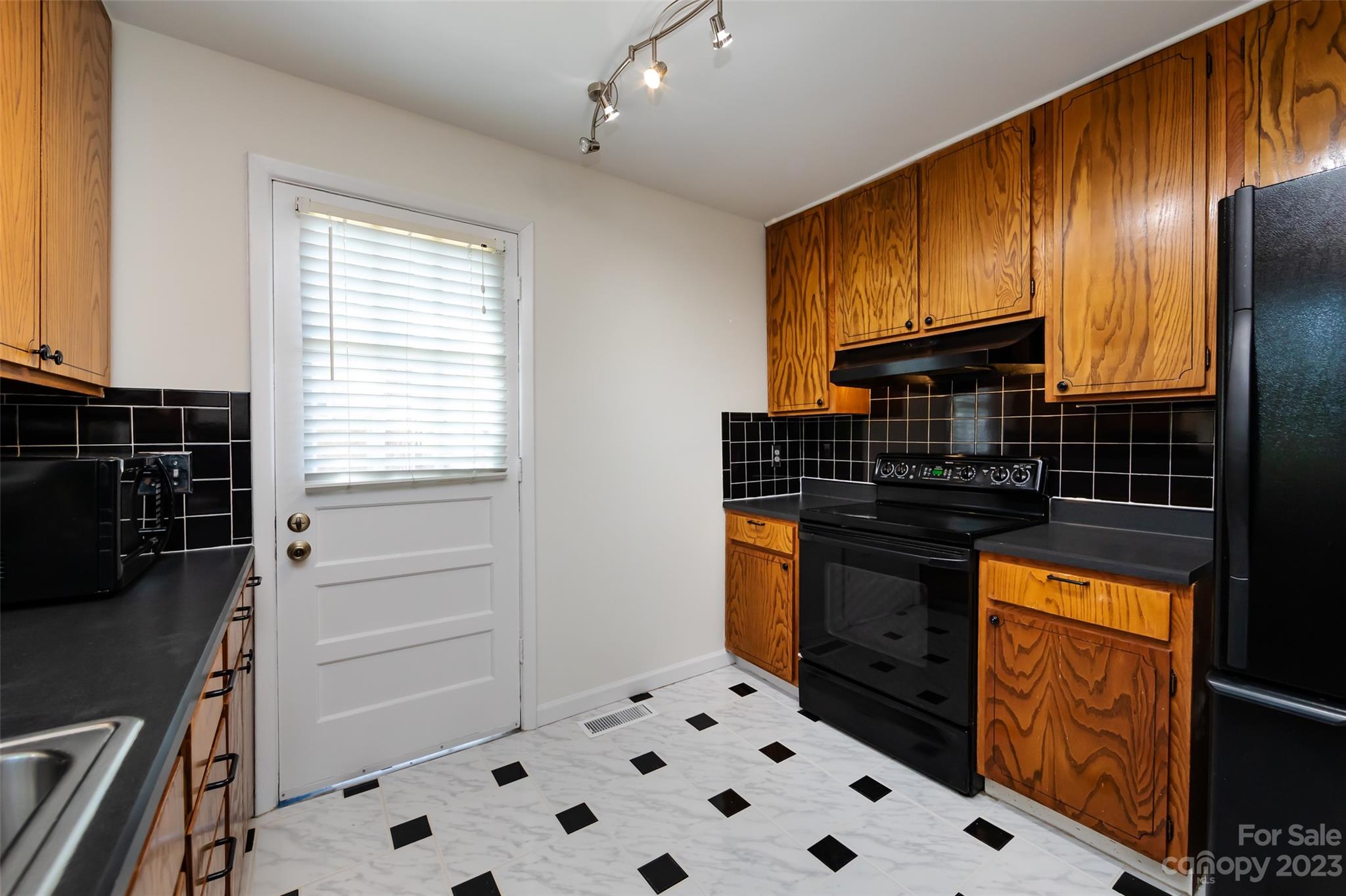 1506 Rama Road Charlotte, NC 28211 - Photo 16 of 48 a kitchen with stainless steel appliances a refrigerator and a sink