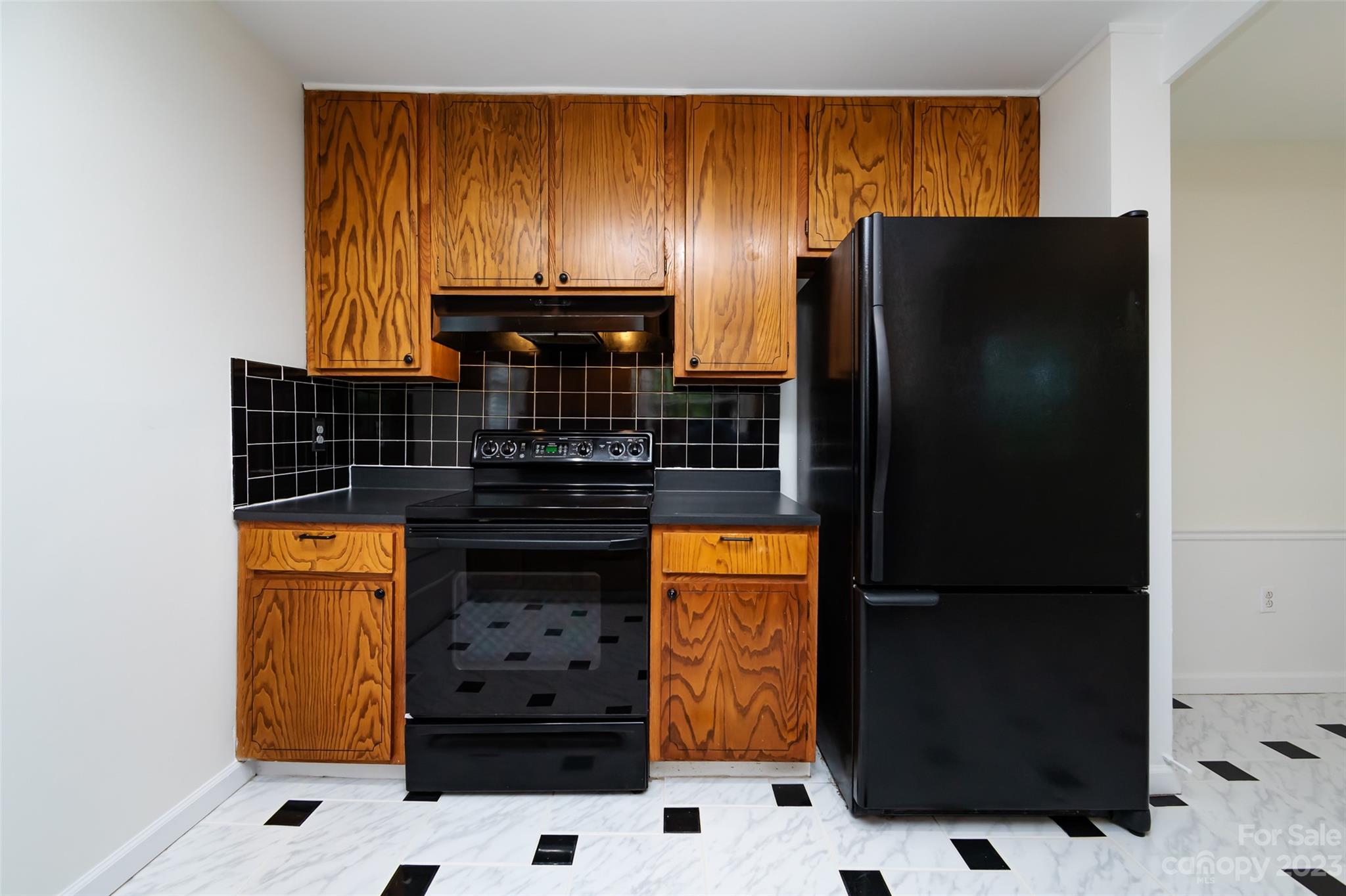 1506 Rama Road Charlotte, NC 28211 - Photo 17 of 48 a kitchen with stainless steel appliances a refrigerator and a stove top oven