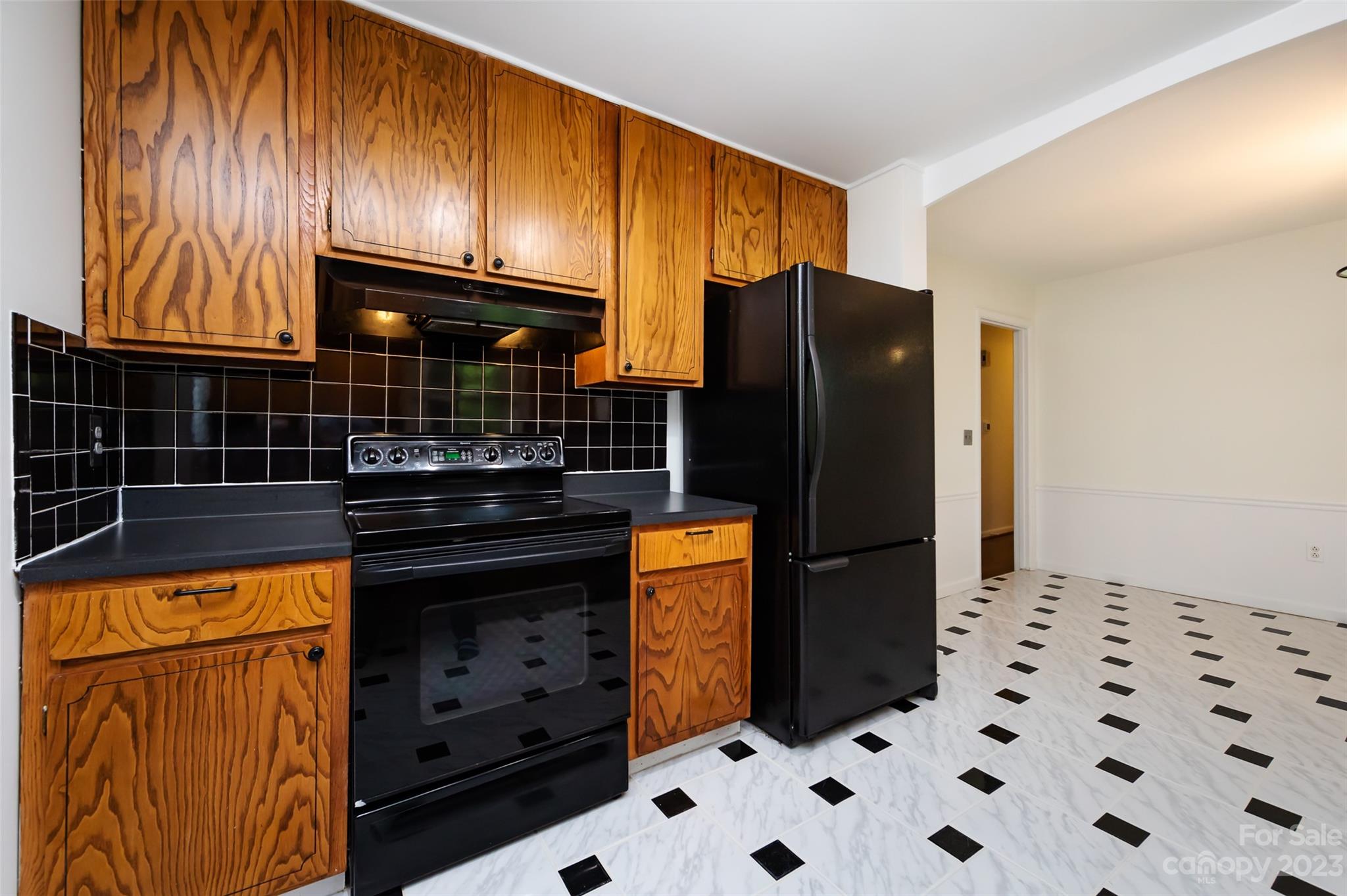 1506 Rama Road Charlotte, NC 28211 - Photo 18 of 48 a kitchen with stainless steel appliances granite countertop a refrigerator and a stove