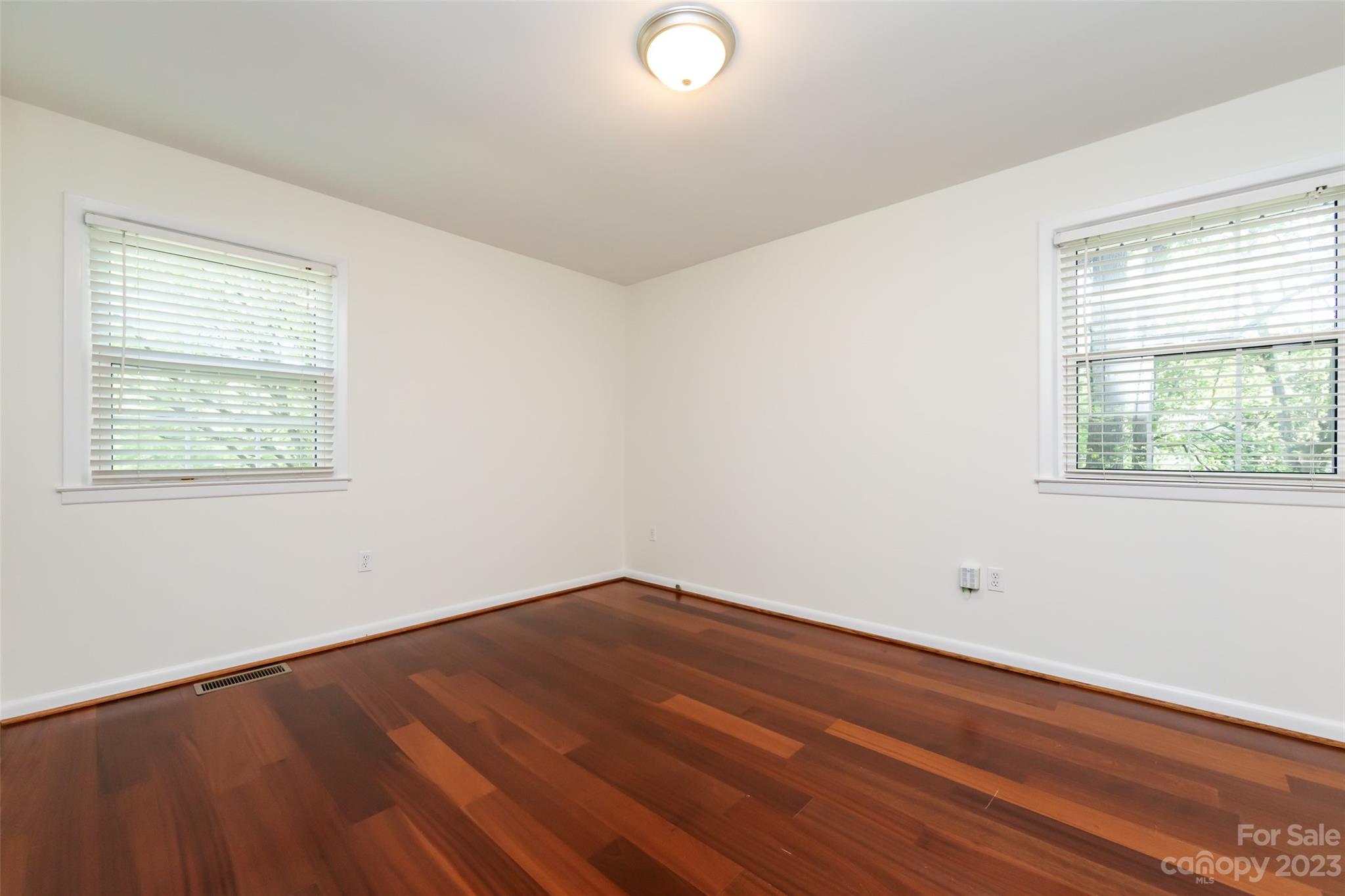 1506 Rama Road Charlotte, NC 28211 - Photo 20 of 48 wooden floor in an empty room with a window
