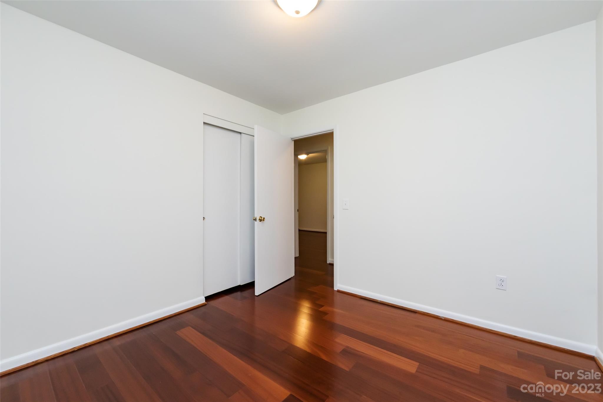 1506 Rama Road Charlotte, NC 28211 - Photo 24 of 48 a view of an empty room with wooden floor