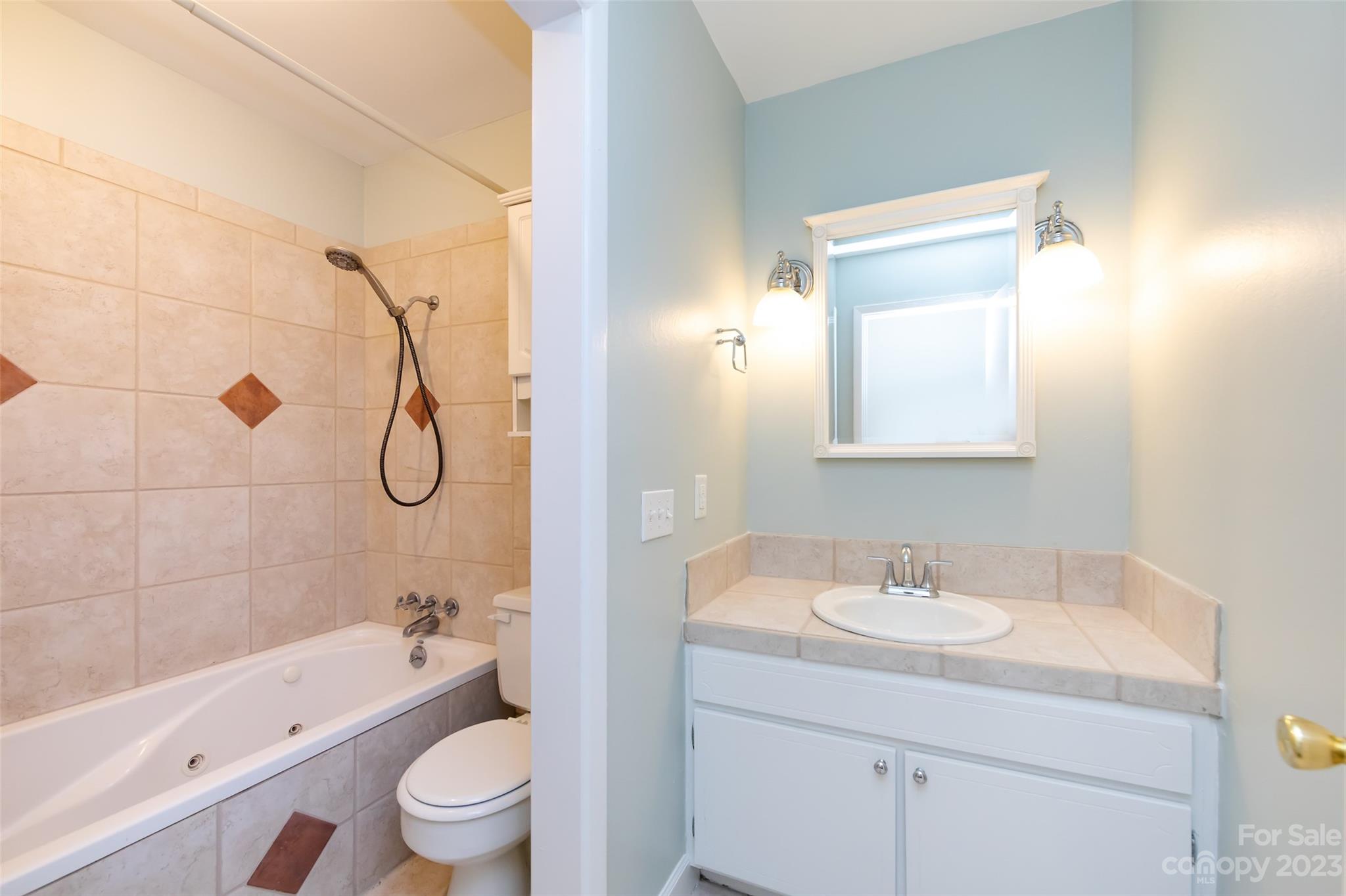 1506 Rama Road Charlotte, NC 28211 - Photo 26 of 48 a bathroom with a sink a toilet and shower