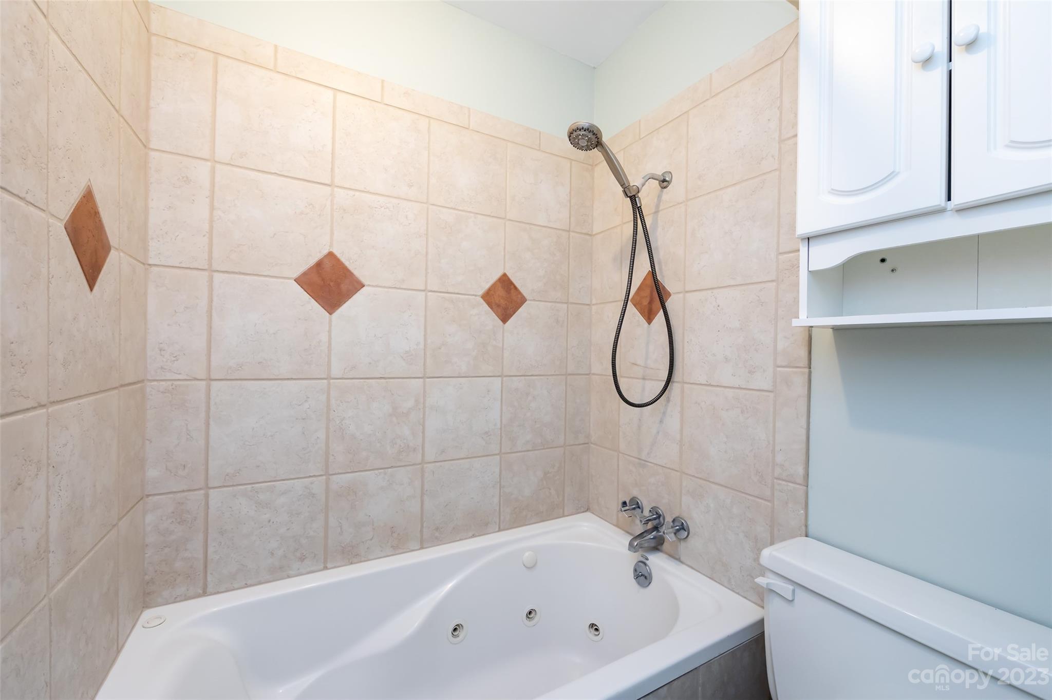 1506 Rama Road Charlotte, NC 28211 - Photo 27 of 48 a bathroom with a bath tub with white walls