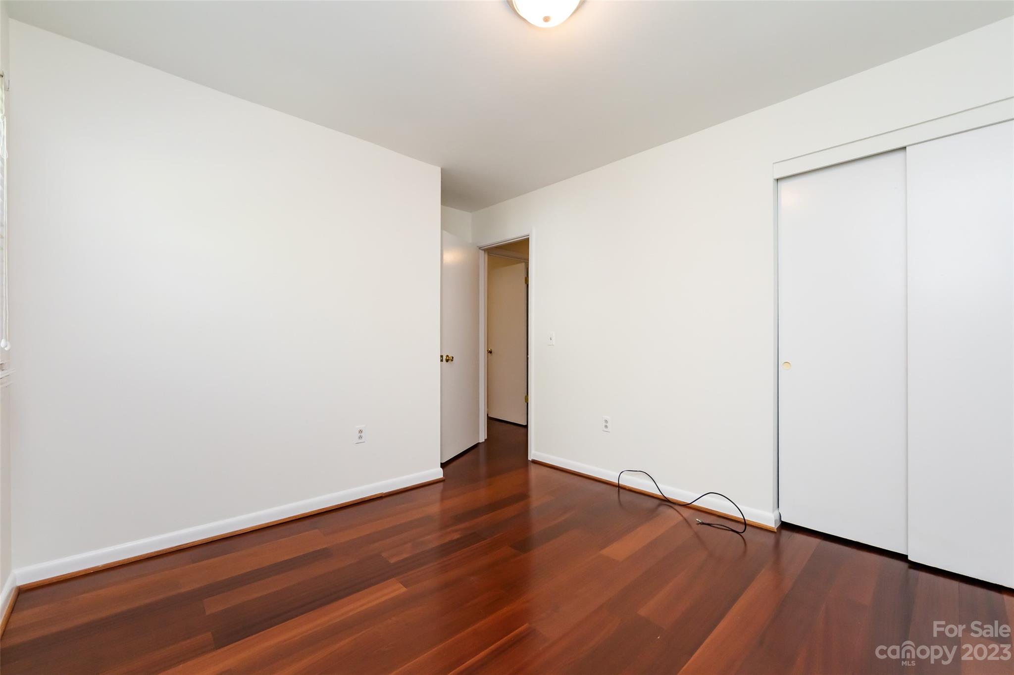 1506 Rama Road Charlotte, NC 28211 - Photo 29 of 48 a view of an empty room with wooden floor