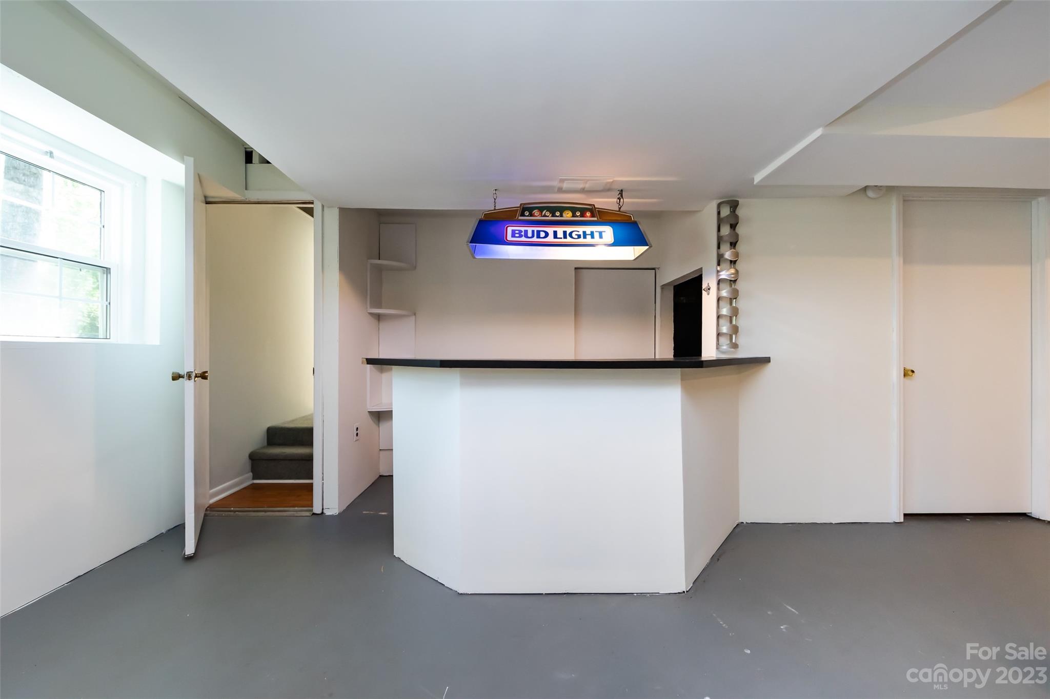 1506 Rama Road Charlotte, NC 28211 - Photo 35 of 48 a view of a kitchen with a fridge and window