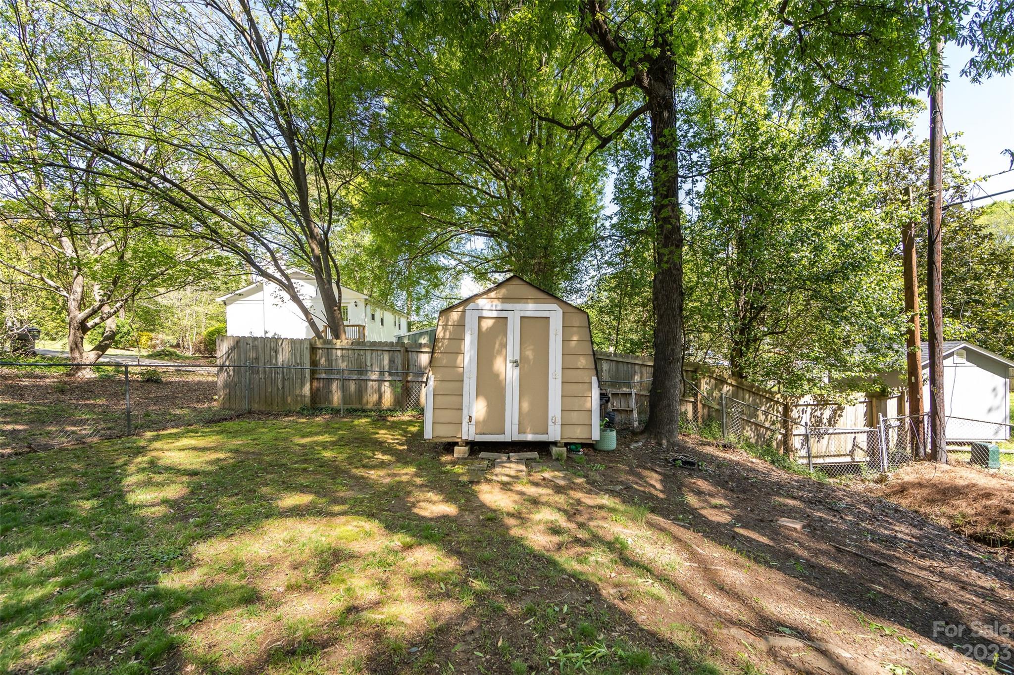 1506 Rama Road Charlotte, NC 28211 - Photo 44 of 48 a view of a house with a large tree and a yard