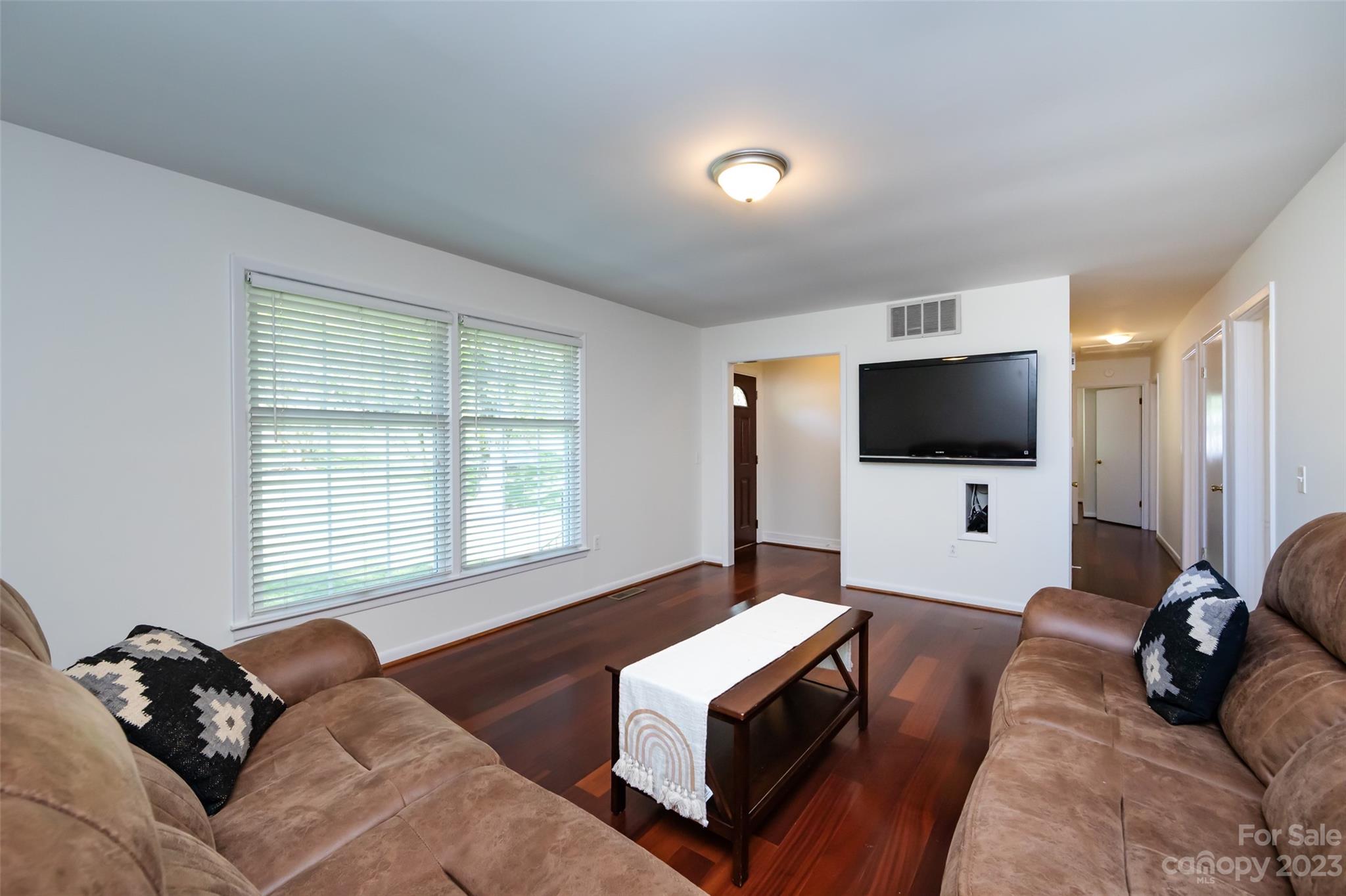 1506 Rama Road Charlotte, NC 28211 - Photo 6 of 48 a living room with furniture and a flat screen tv