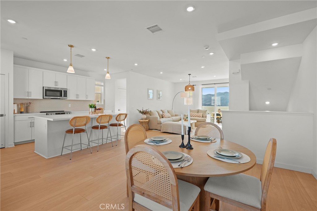 131 Ruby Road Rancho Mission Viejo, CA 92694 - Photo 16 of 65 a view of a dining room with furniture