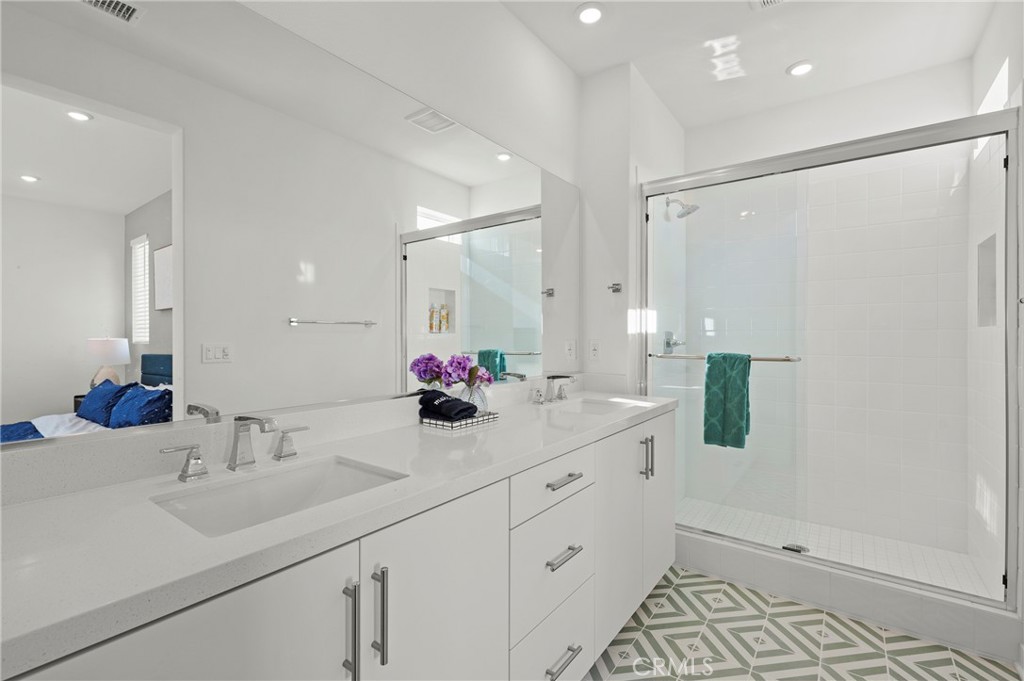 131 Ruby Road Rancho Mission Viejo, CA 92694 - Photo 39 of 65 a bathroom with double sink and a mirror