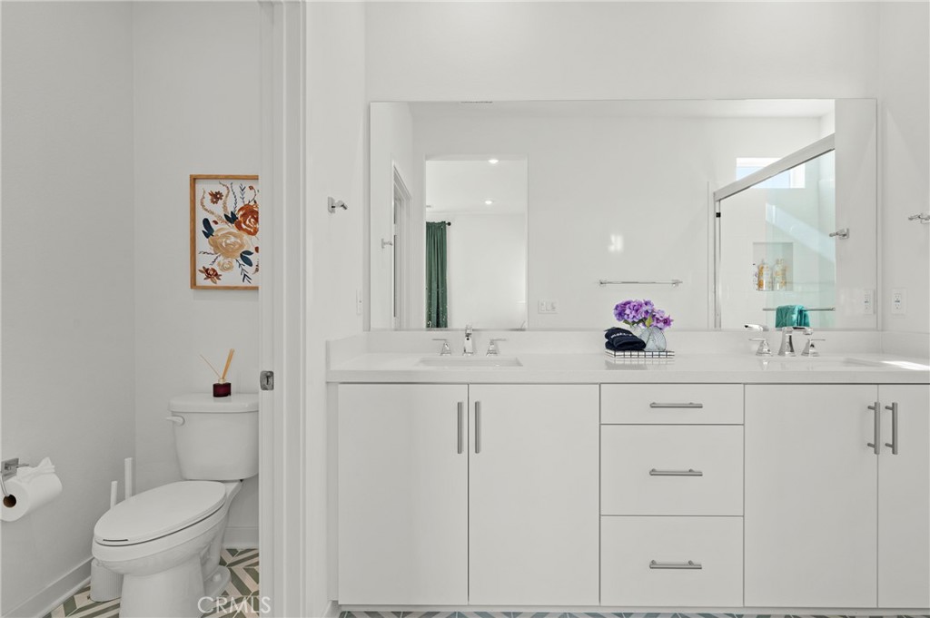 131 Ruby Road Rancho Mission Viejo, CA 92694 - Photo 40 of 65 a bathroom with a sink vanity mirror and toilet