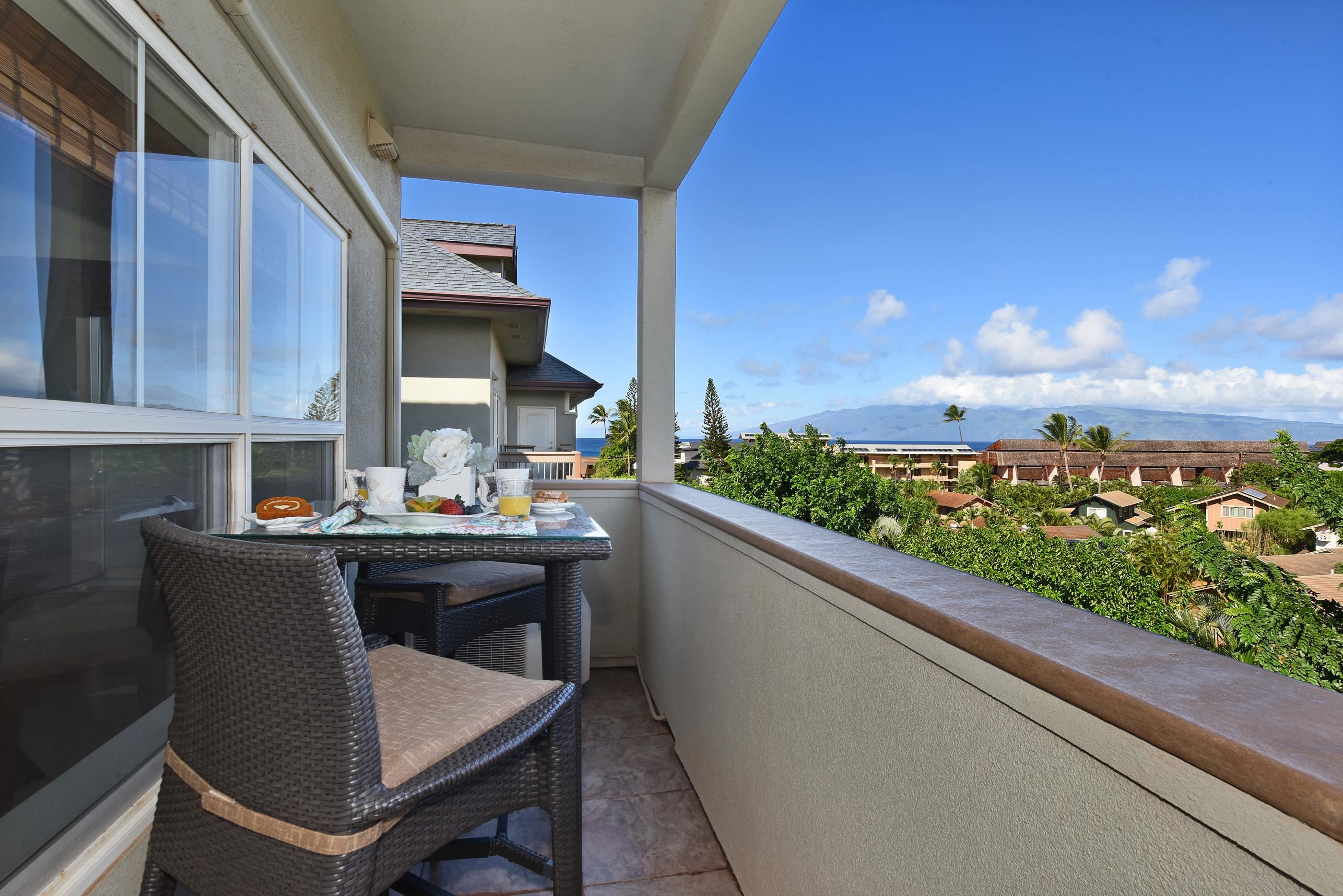 3708 Lower Honoapiilani Road, Unit E30 Lahaina, HI 96761 - Photo 1 of 30 a view of a chairs and table in patio