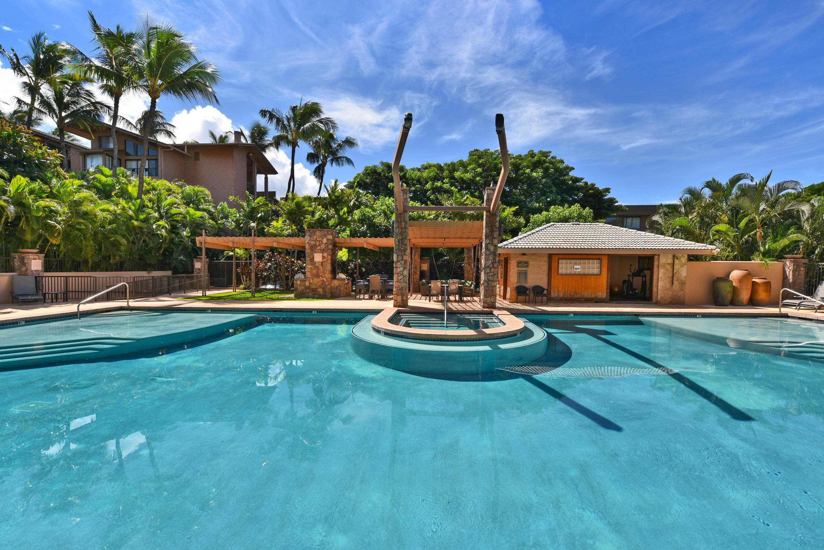 3708 Lower Honoapiilani Road, Unit E30 Lahaina, HI 96761 - Photo 13 of 30 a view of house with backyard space and garden