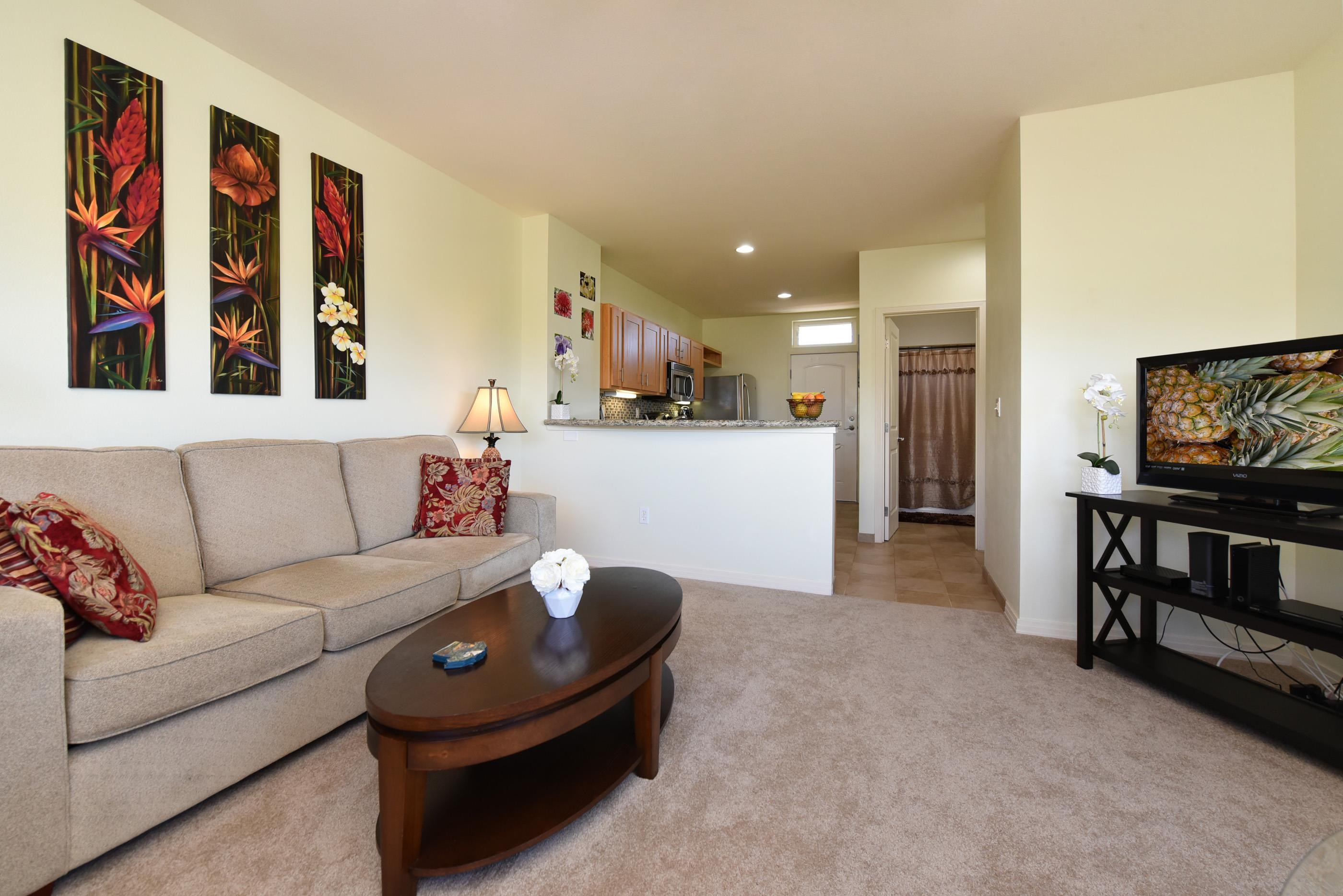 3708 Lower Honoapiilani Road, Unit E30 Lahaina, HI 96761 - Photo 15 of 30 a living room with furniture and a flat screen tv