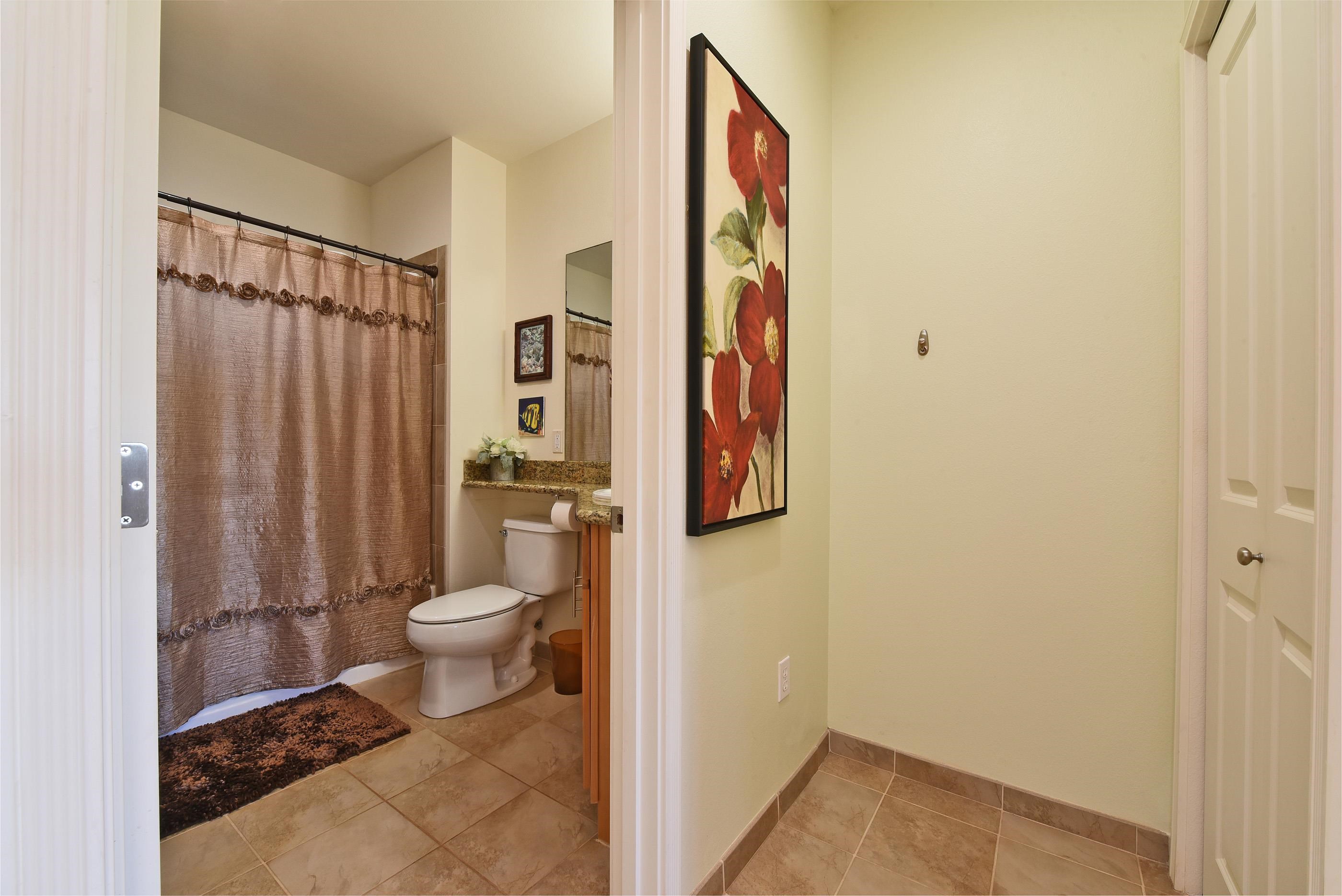 3708 Lower Honoapiilani Road, Unit E30 Lahaina, HI 96761 - Photo 17 of 30 a bathroom with a toilet and a shower