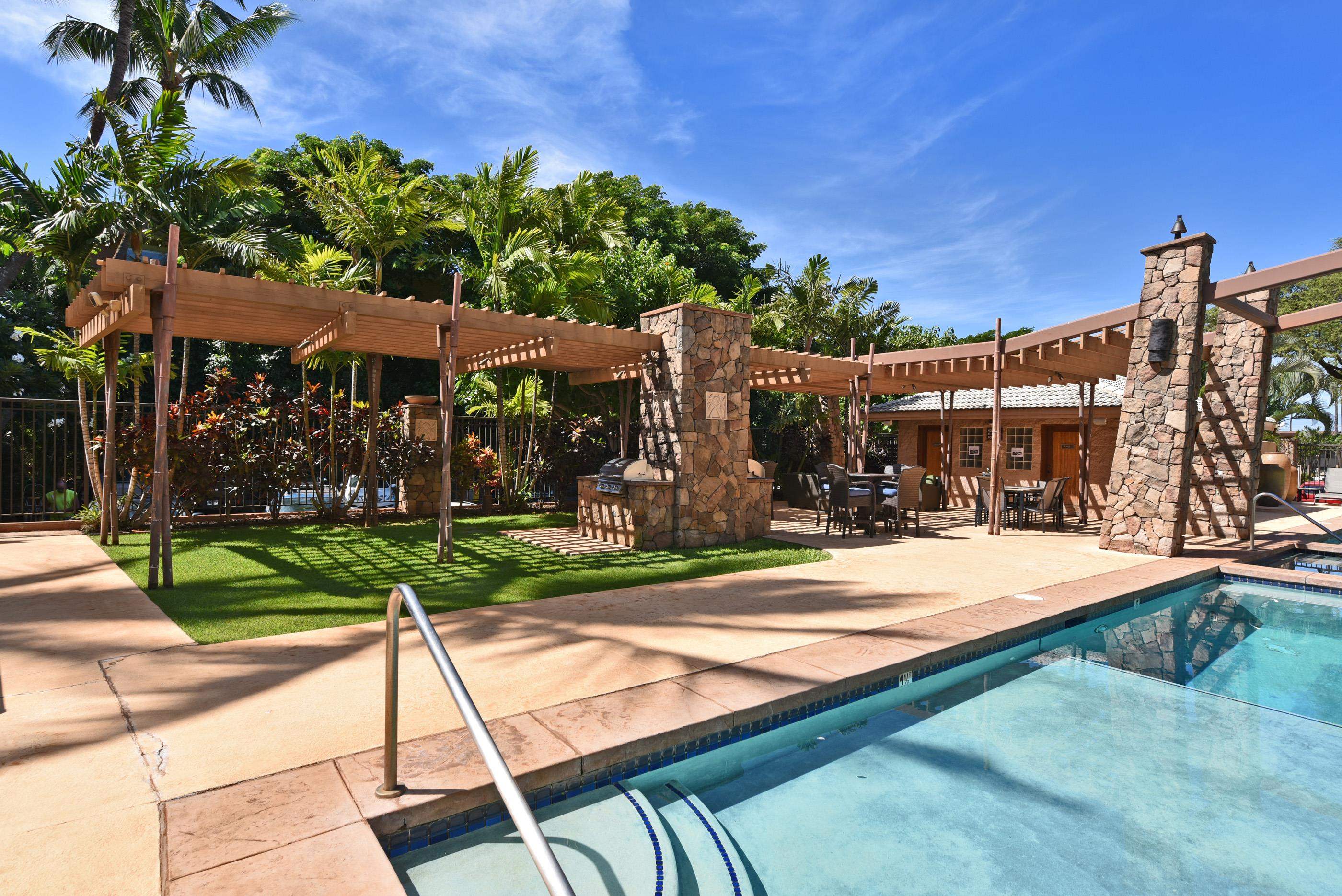 3708 Lower Honoapiilani Road, Unit E30 Lahaina, HI 96761 - Photo 28 of 30 a view of a house with backyard and sitting area