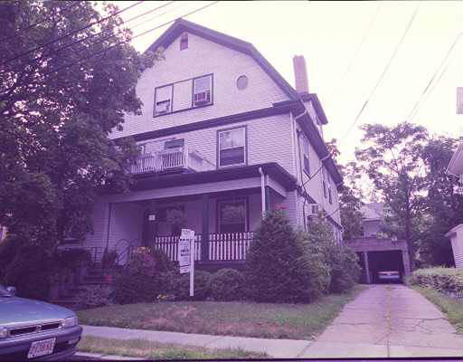 a front view of a building with garden